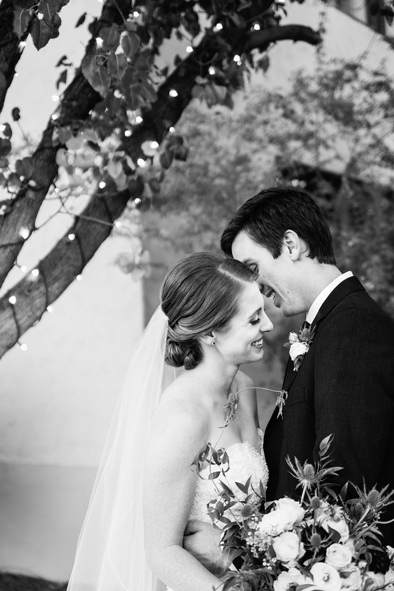 Bride and Groom share an intimate moment during their Secret Garden Events wedding by Phoenix wedding photographer PMA Photography.