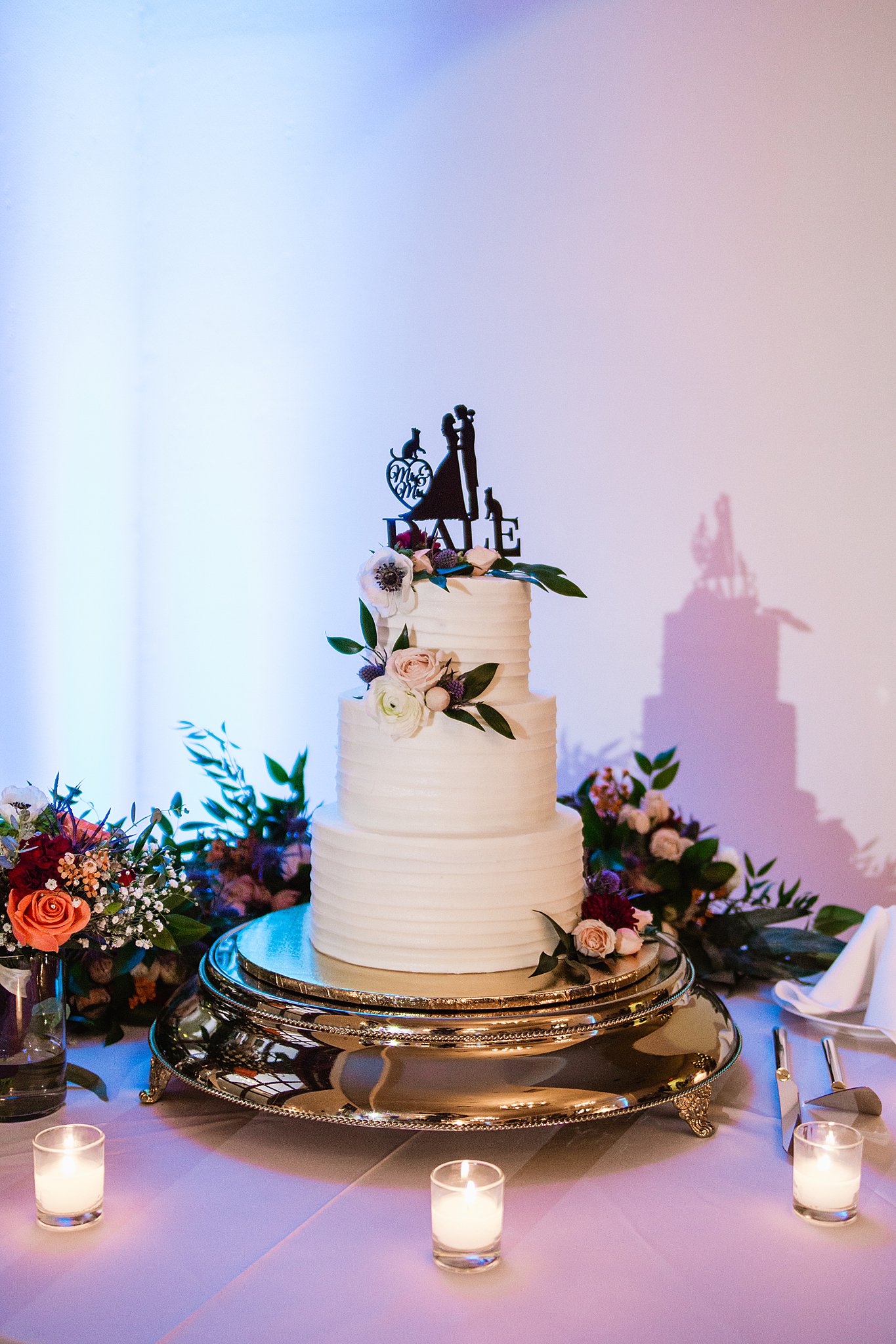 Cake table at Secret Garden Events wedding reception by Arizona wedding photographer PMA Photography.