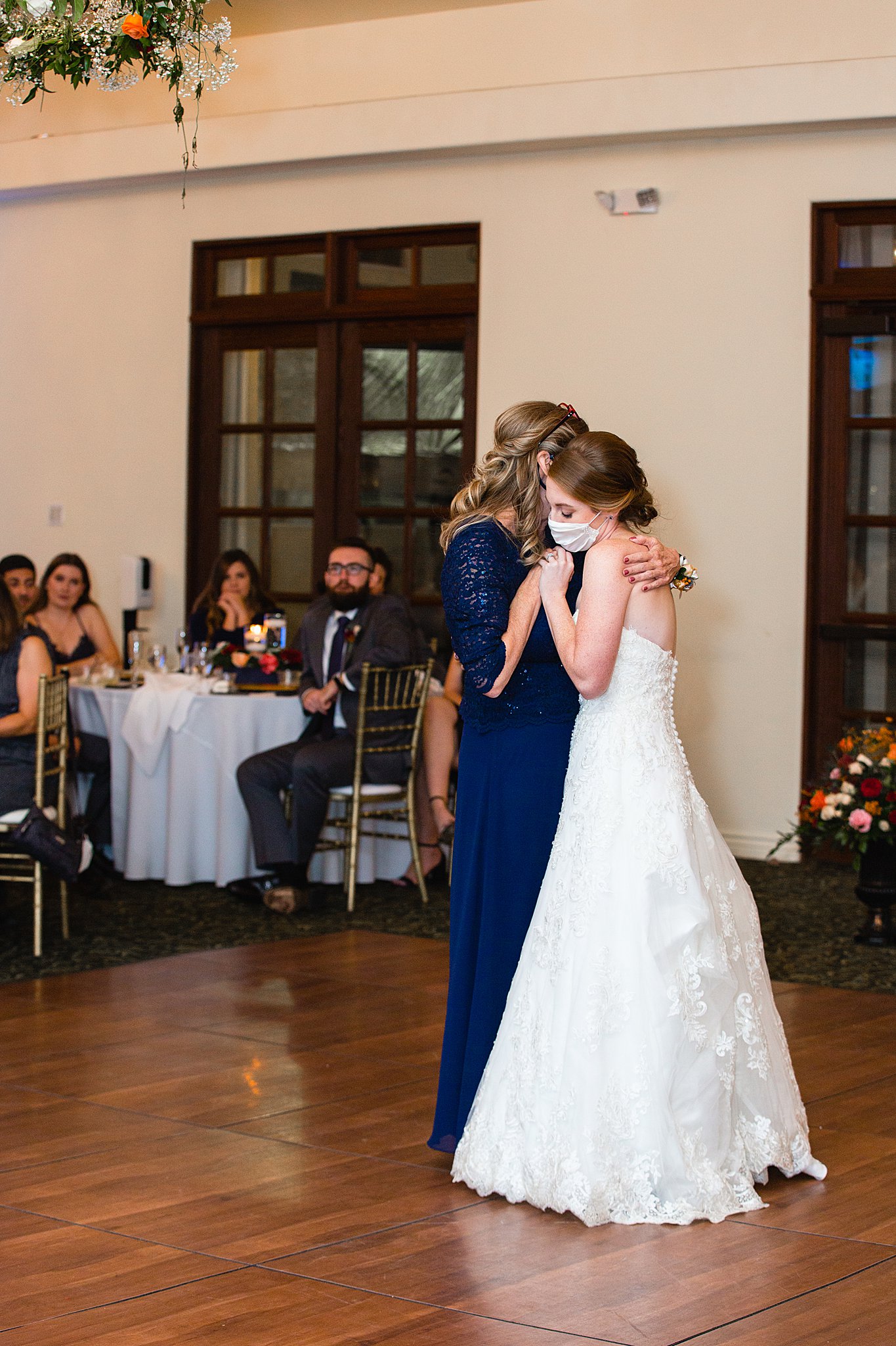 Bride dancing with her mother at Secret Garden Events wedding reception by Phoenix wedding photographer PMA Photography