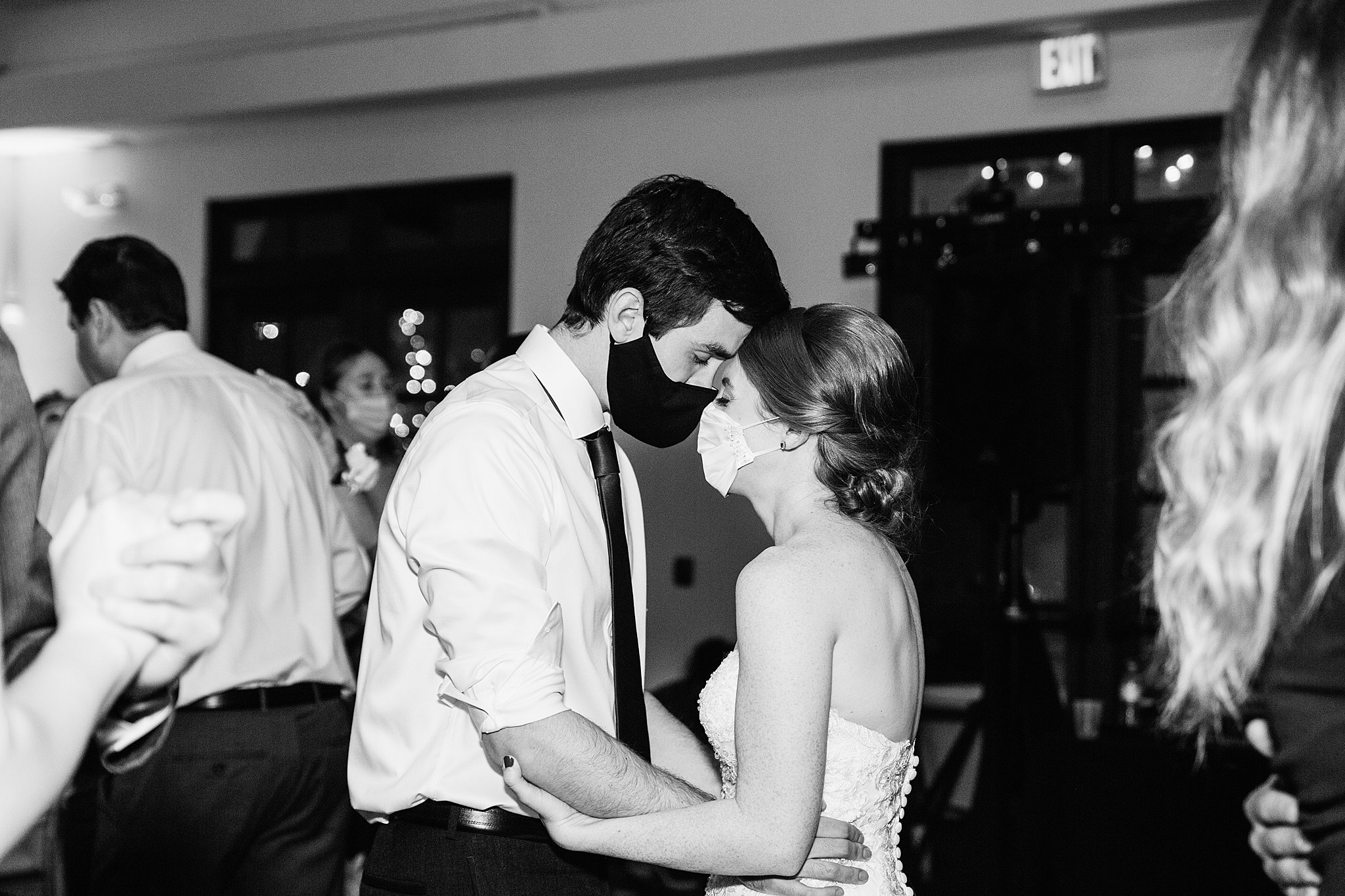 Bride and Groom dancing with guests at their Secret Garden Events wedding reception by Arizona wedding photographer PMA Photography
