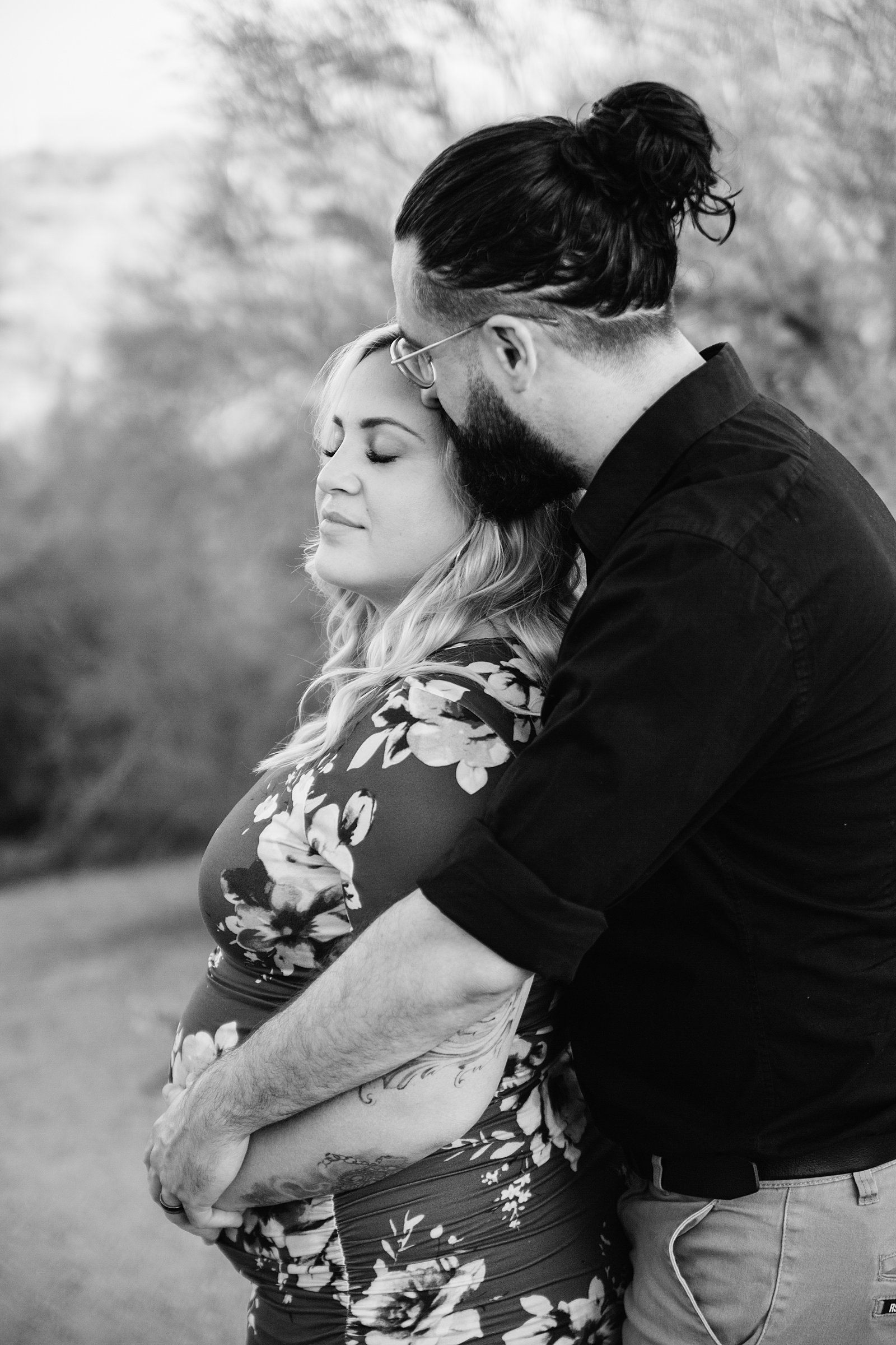 Couple share an intimate moment during their Papago Park maternity session by Phoenix engagement photographer PMA Photography.