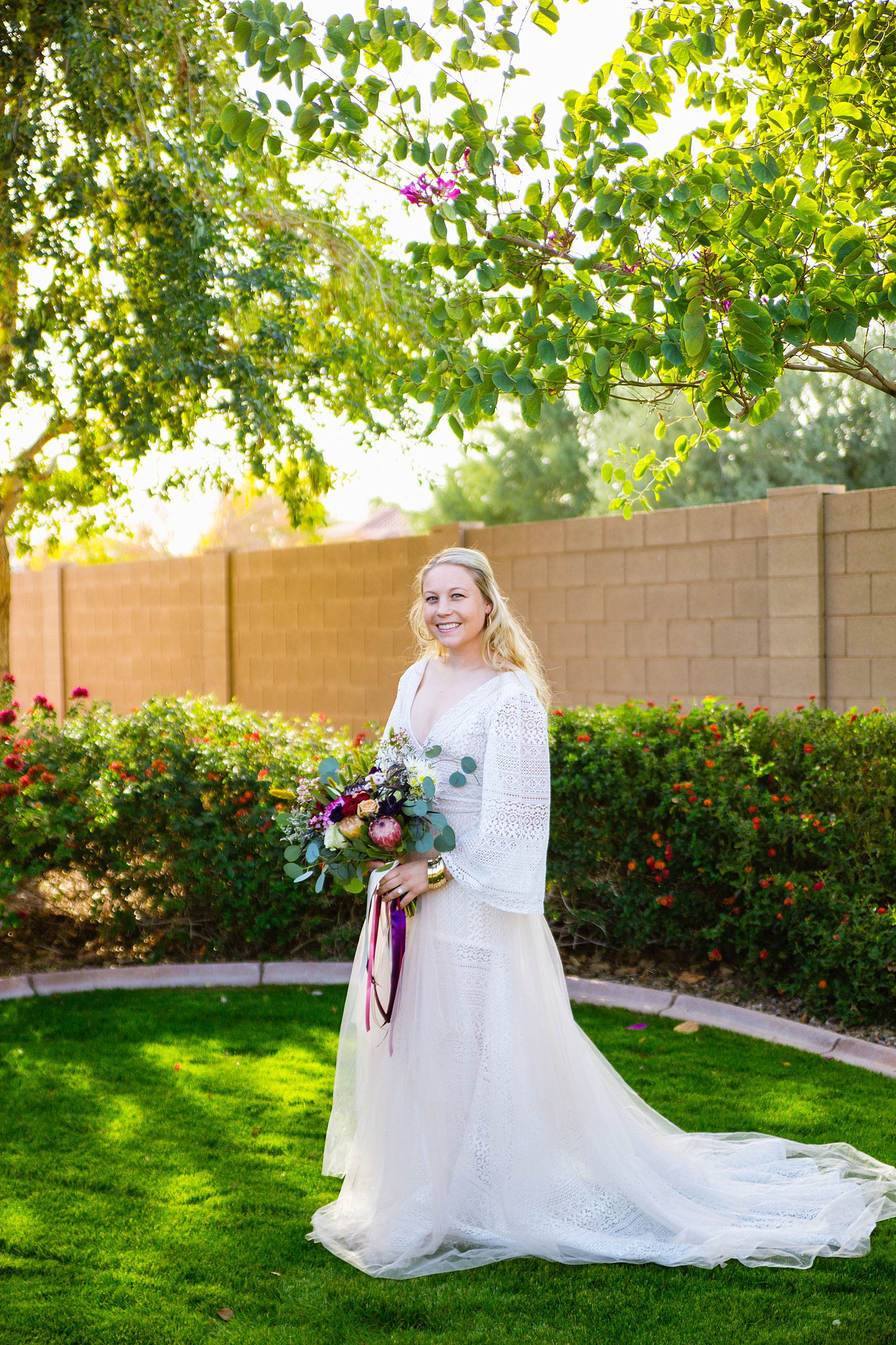 Bride's boho wedding dress for her backyard wedding by PMA Photography.