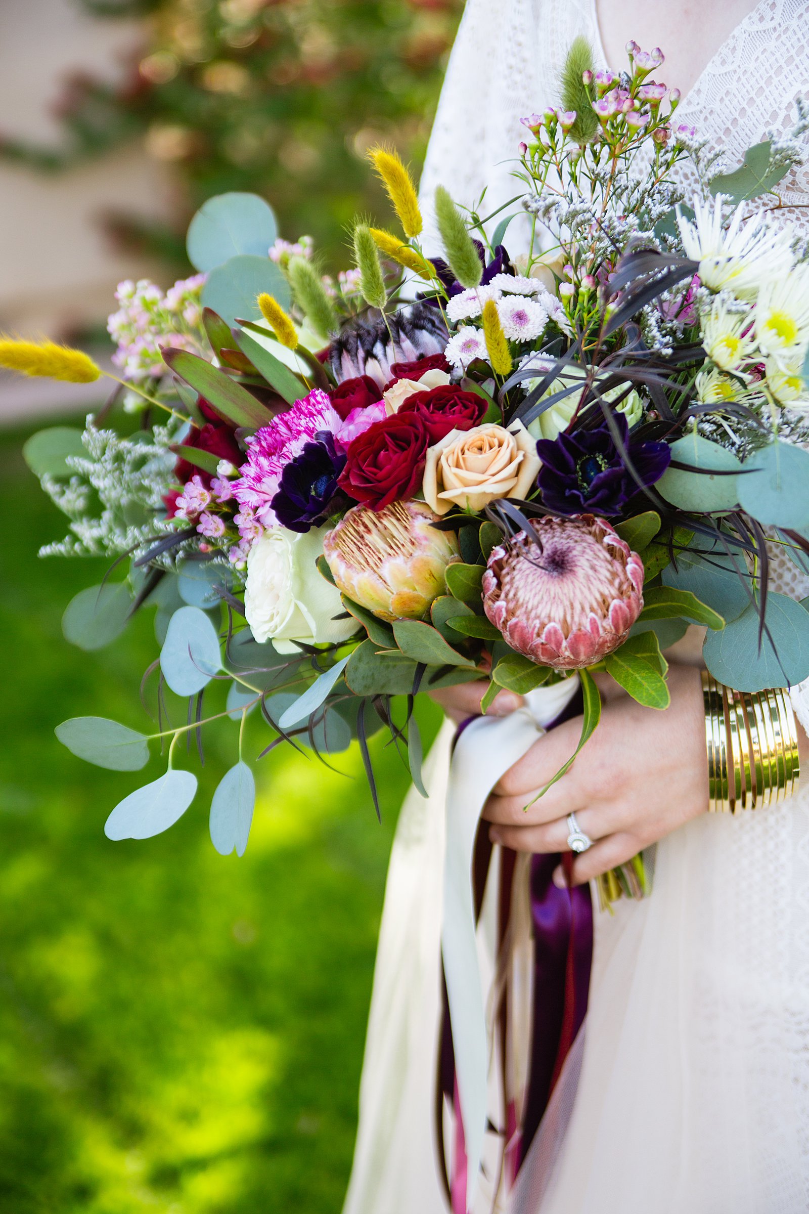 Bride's colorful boho bouquet by PMA Photography.