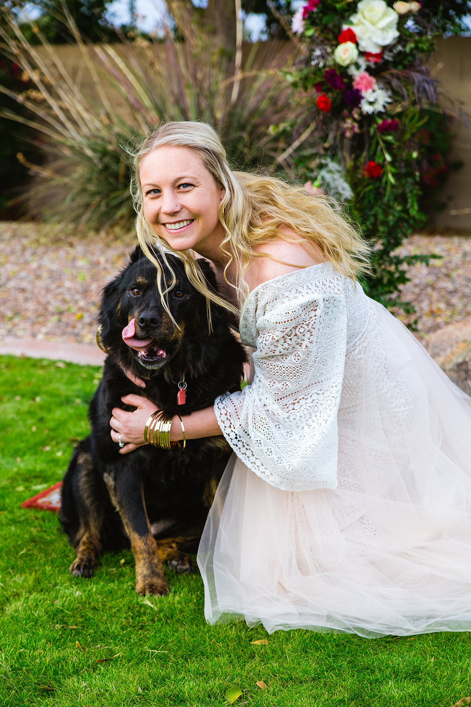 Bride poses with her dog for their Backyard wedding by Phoenix wedding photographer PMA Photography.