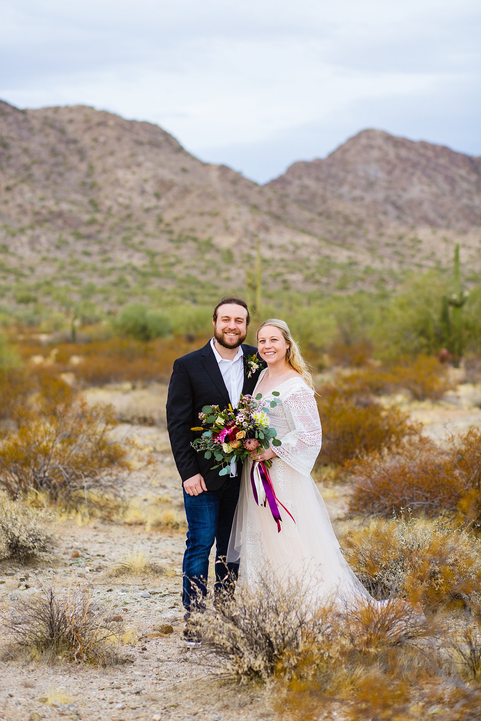 Bride and Groom pose during their San Tan Regional Park wedding by Arizona wedding photographer PMA Photography.