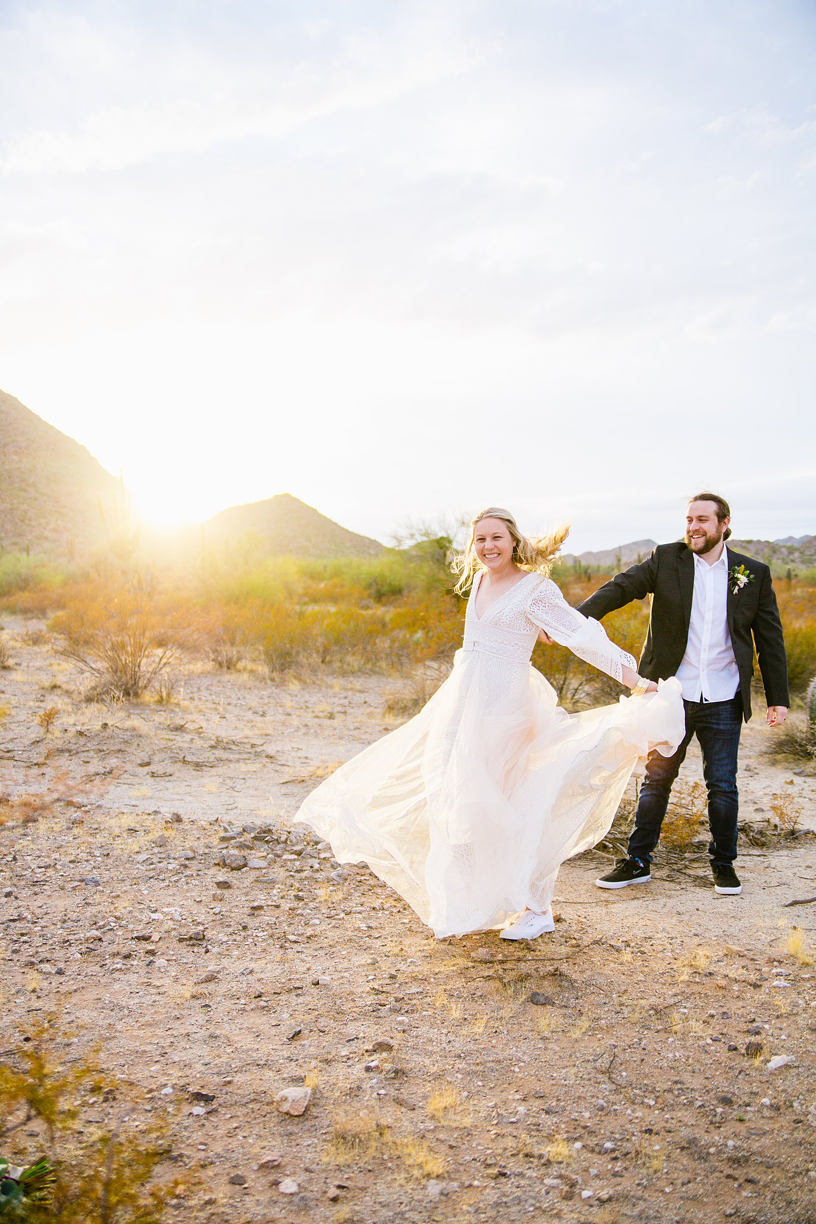 Bride and Groom dancingtogether during their San Tan Regional Park wedding by Arizona wedding photographer PMA Photography.