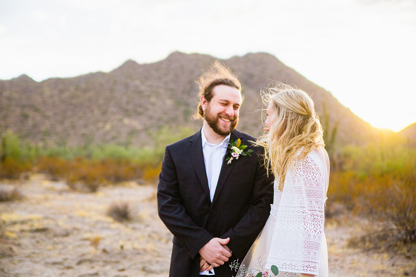 Bride and Groom laughing together during their San Tan Regional Park wedding by Phoenix wedding photographer PMA Photography.