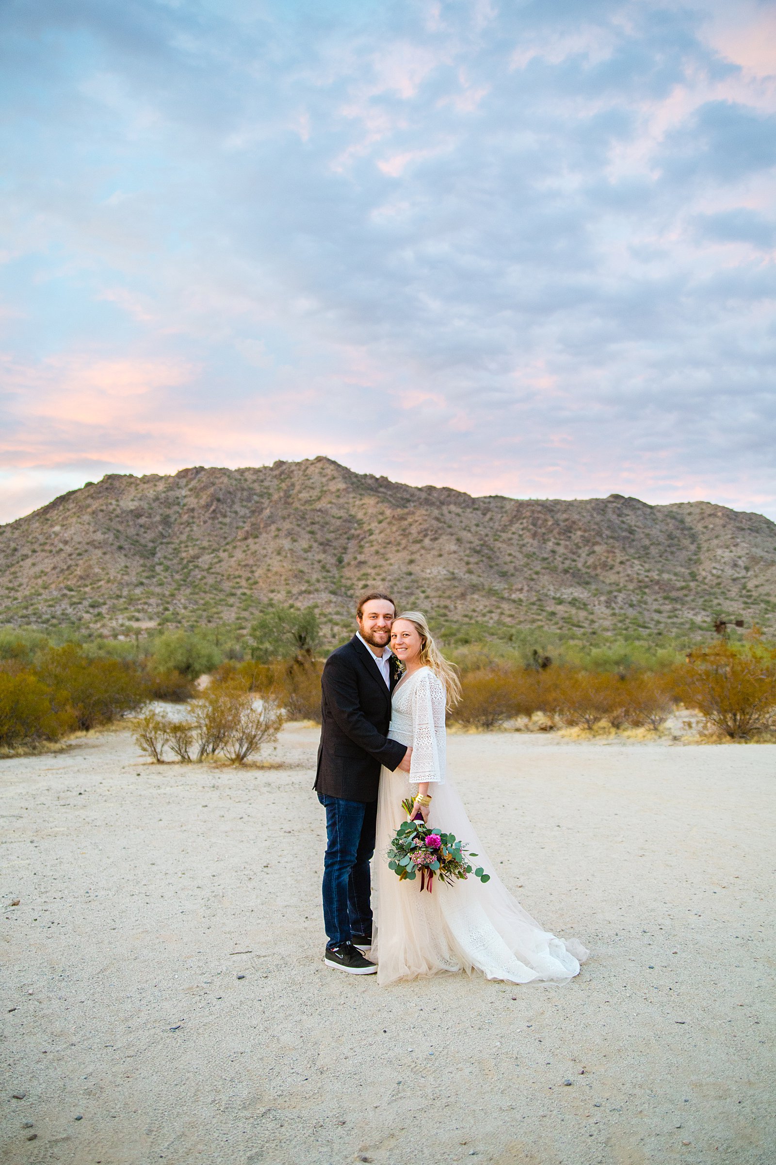 Bride and Groom pose during their San Tan Regional Park wedding by Arizona wedding photographer PMA Photography.