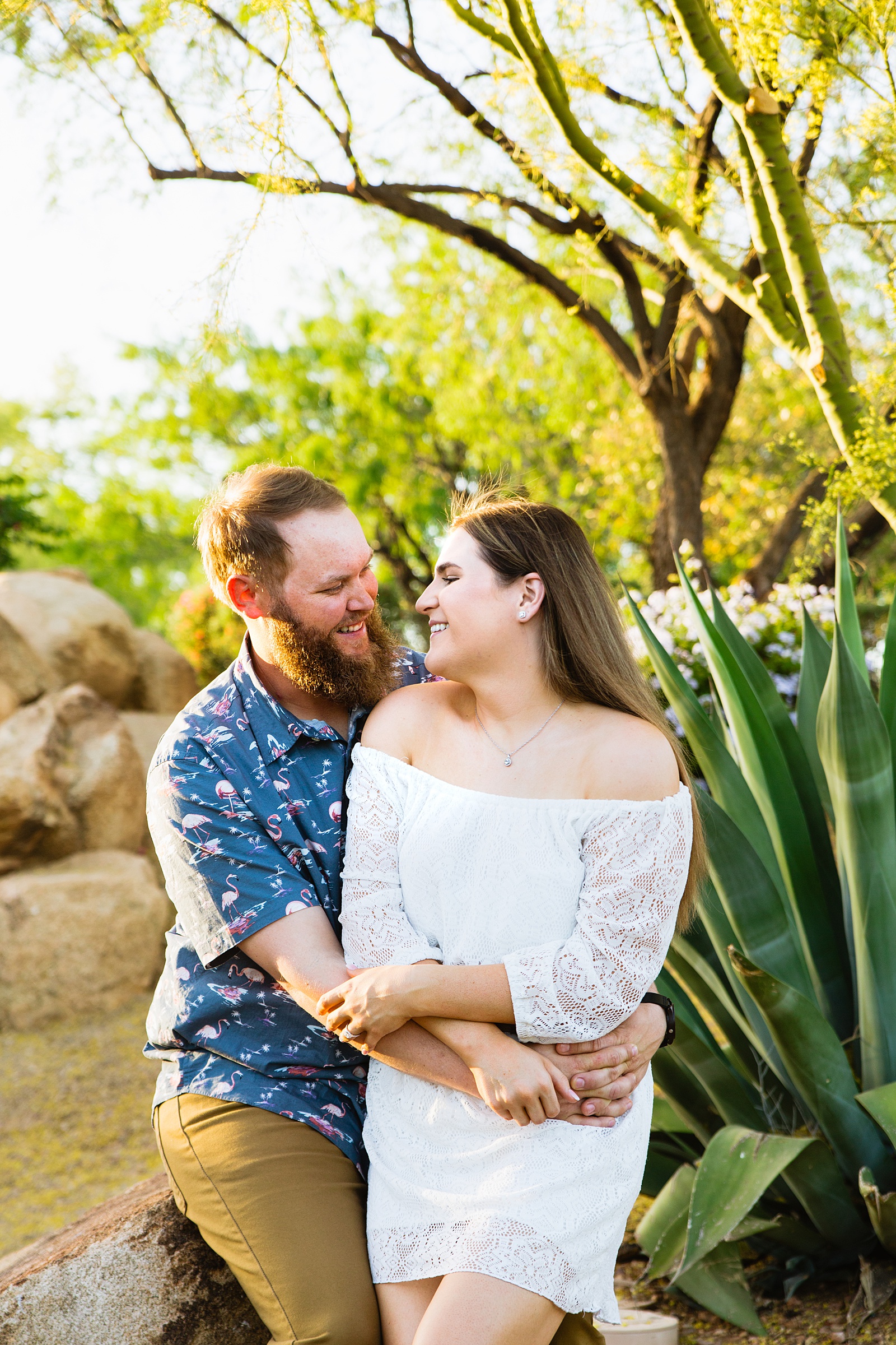 Couple share an intimate moment during their Anthem Park engagement session by Phoenix engagement photographer PMA Photography.