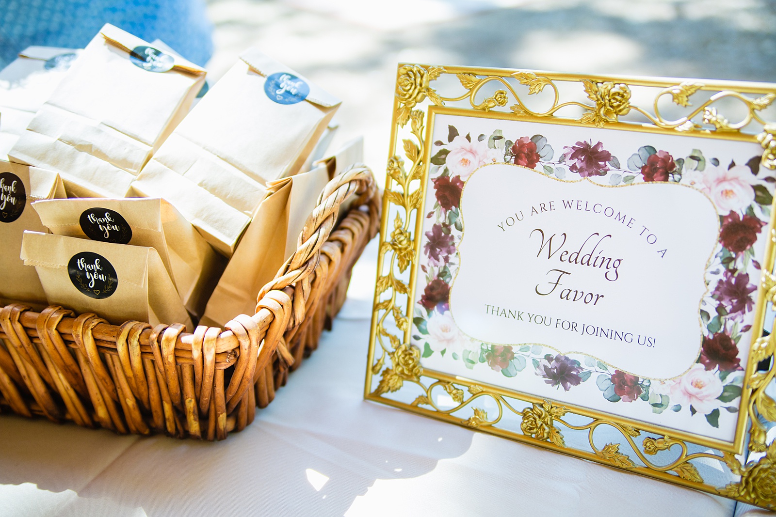 Floral wedding favors sign at a renaissance inspired wedding in the forest by Flagstaff wedding photographer PMA Photography.