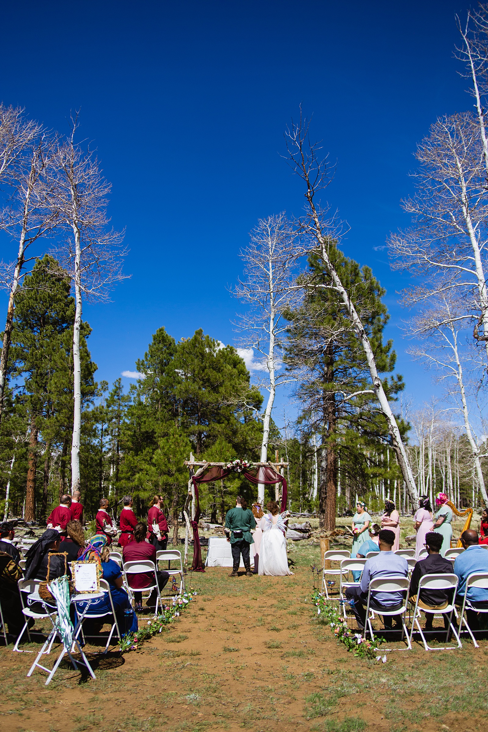 Wedding ceremony at Arizona Nordic Village by Arizona wedding photographer PMA Photography.