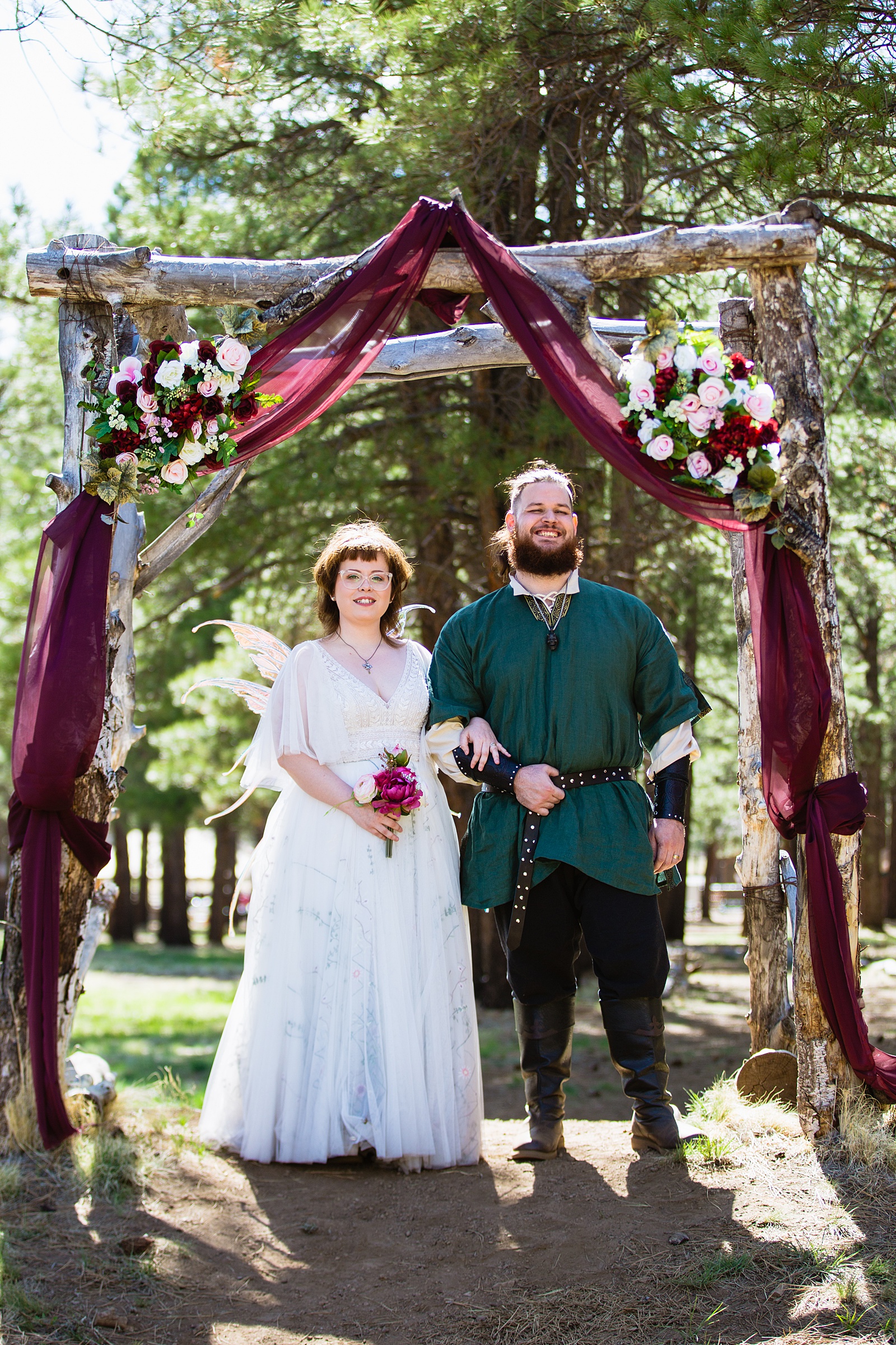 Newlyweds pose during their Arizona Nordic Village wedding by Arizona wedding photographer PMA Photography.