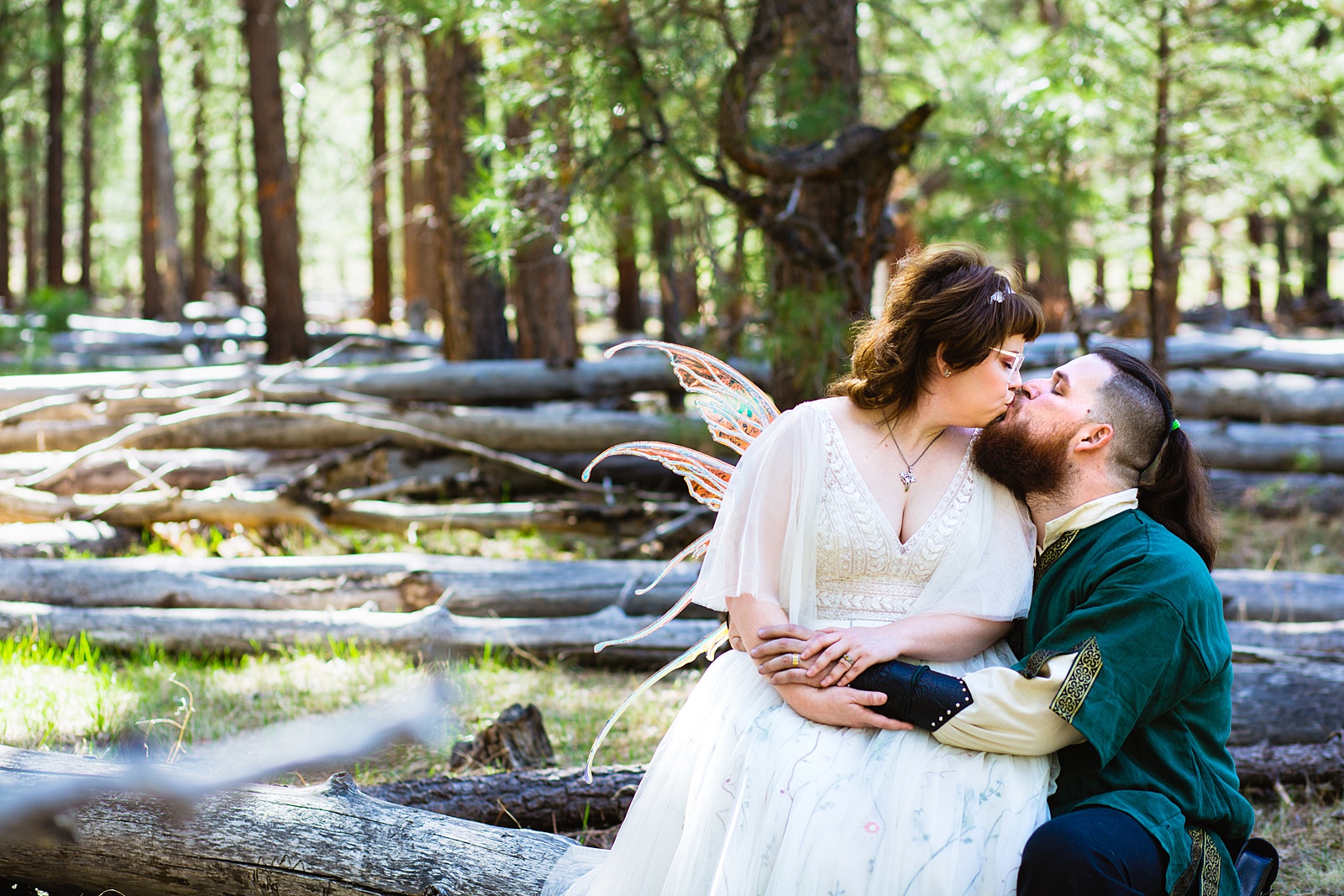 Newlyweds share a kiss during their Arizona Nordic Village wedding by Arizona wedding photographer PMA Photography.