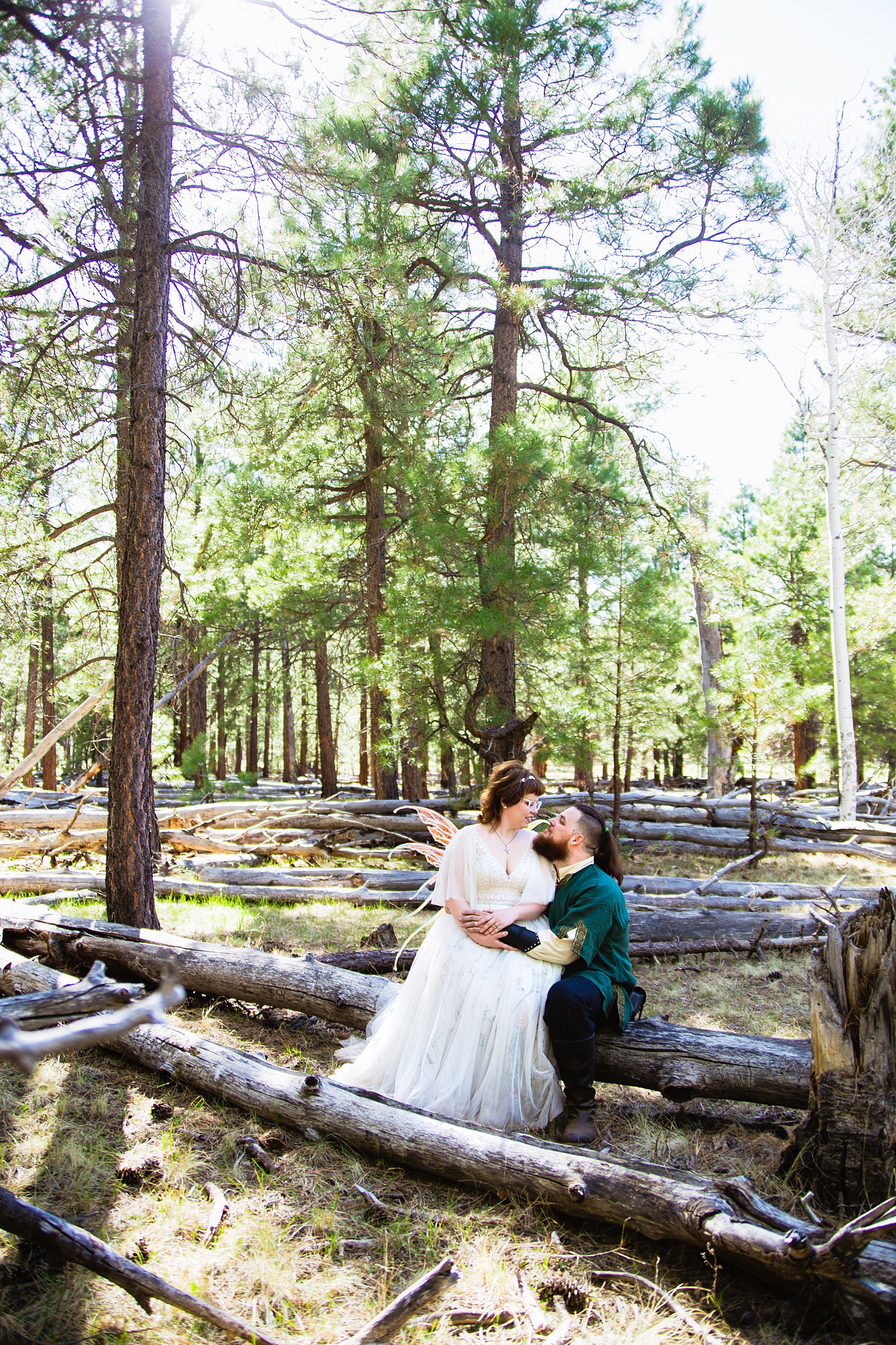 Newlyweds share an intimate moment during their Arizona Nordic Village wedding by Flagstaff wedding photographer PMA Photography.