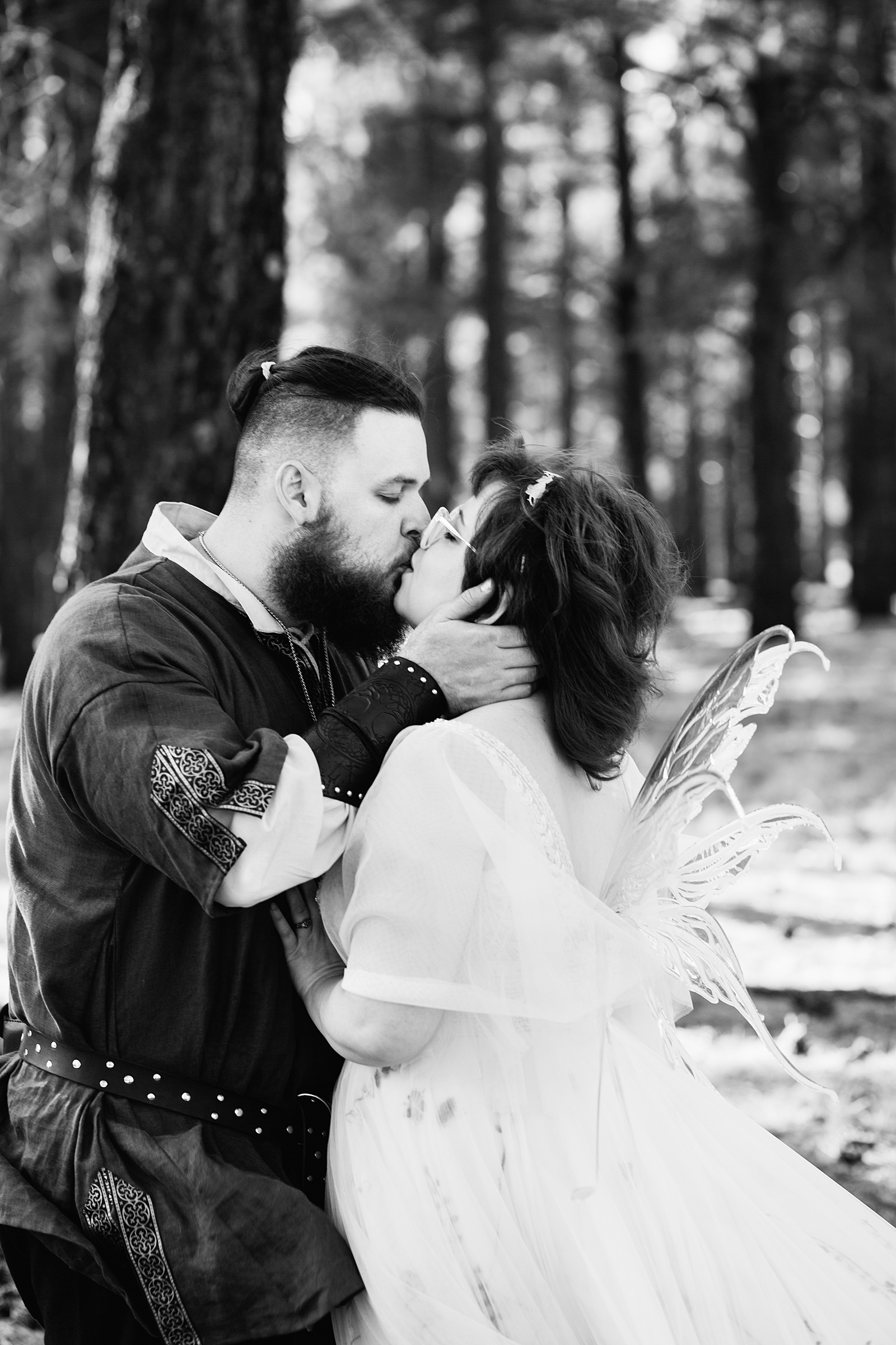 Newlyweds share a kiss during their Arizona Nordic Village wedding by Arizona wedding photographer PMA Photography.