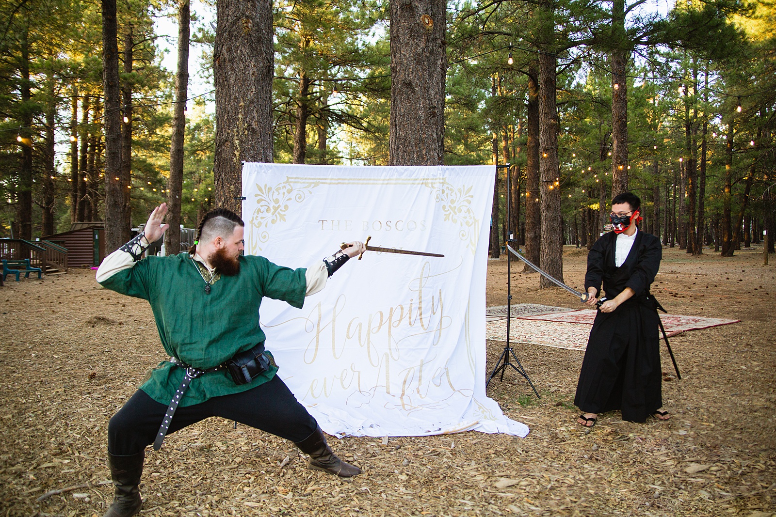 Groom poses with guests at a fairy tale inspired DIY photo booth by Arizona wedding photographer PMA Photography.