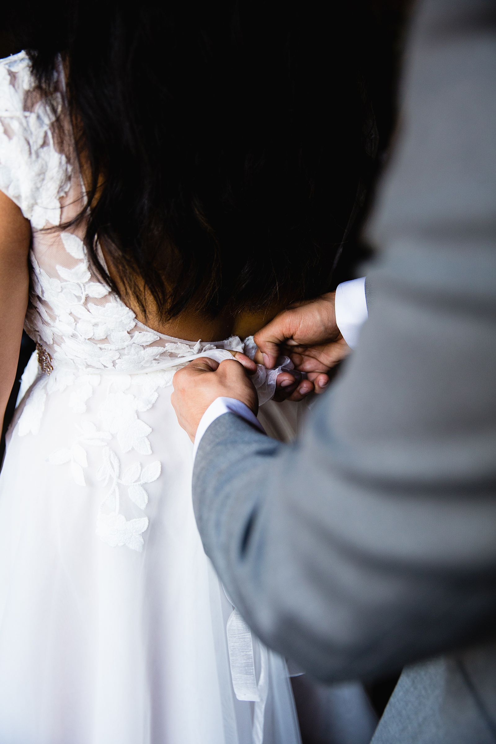 Bride getting ready for her elopement by Arizona elopement photographers PMA Photographer
