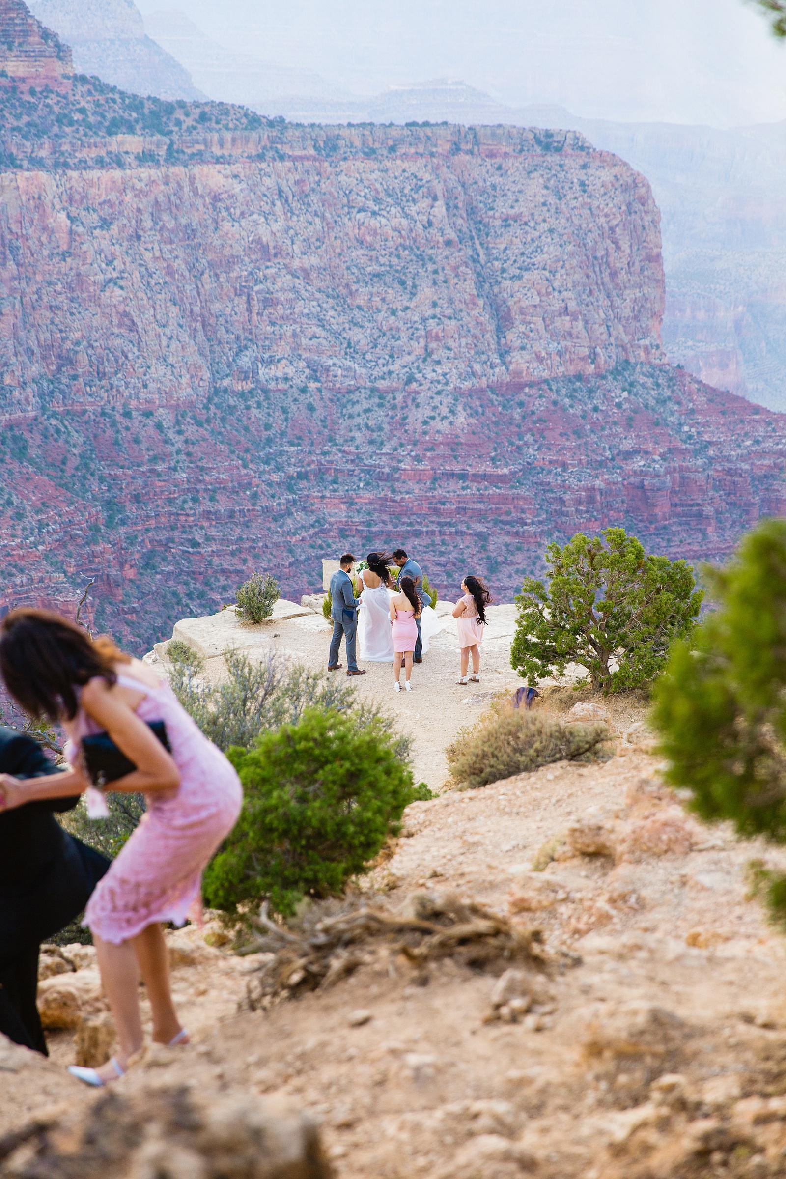 Bride walking to the ceremony space at her Grand Canyon elopement by Arizona elopement photographer PMA Photography.