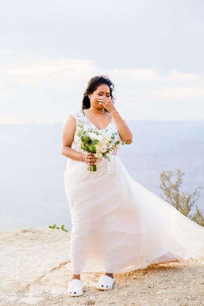 Bride seeing her bride for the first time at their Grand Canyon wedding ceremony by PMA Photography.