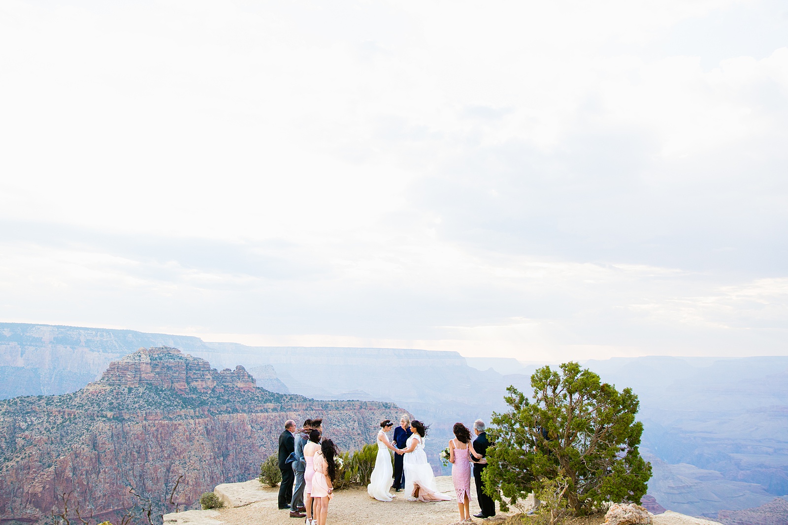 Same sex wedding ceremony at Moran Point, Grand Canyon by Arizona elopement photographer PMA Photography.