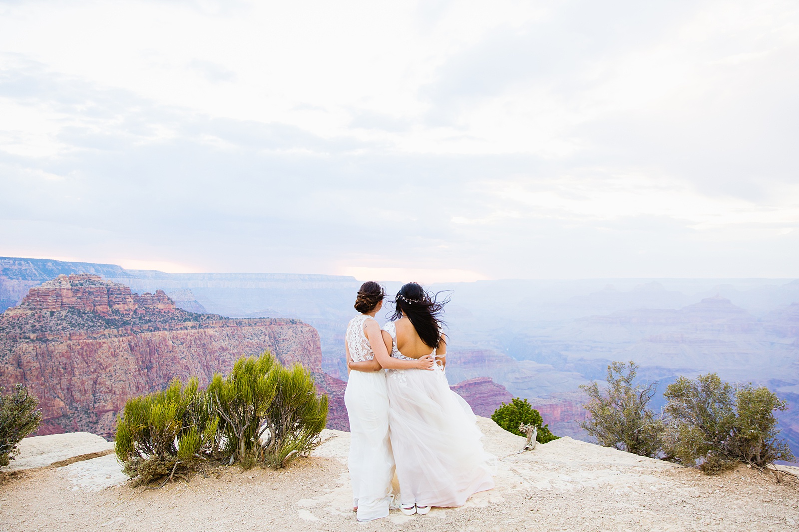 Adventurous LGBTQ+ couple pose during their Moran Point elopement by Arizona elopement photographer PMA Photography.