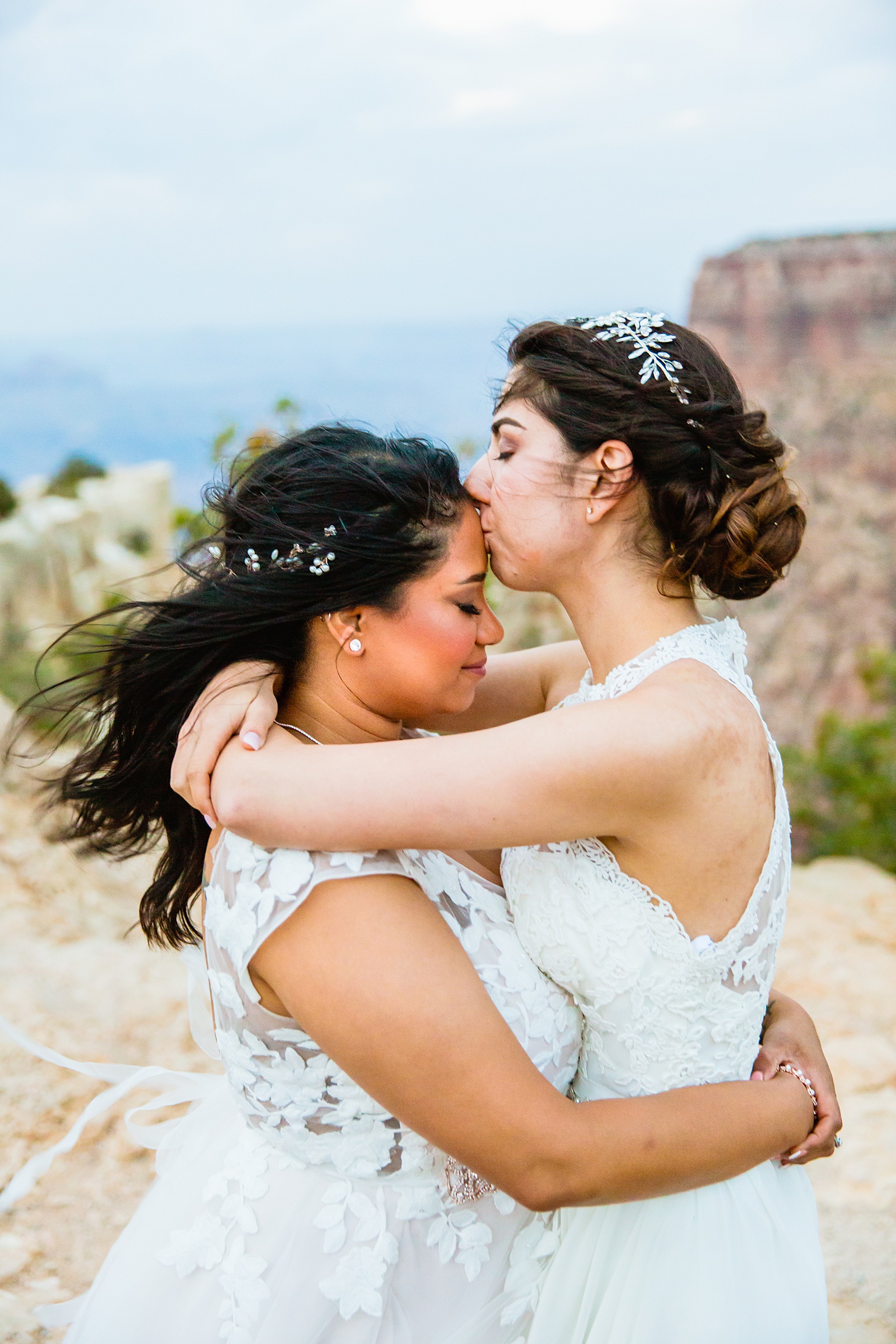Same sex couple share a kiss during their Moran Point elopement by Arizona elopement photographer PMA Photography.
