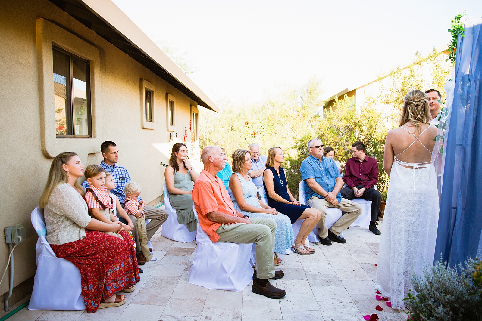 Wedding ceremony at a backyard by Phoenix wedding photographer PMA Photography.
