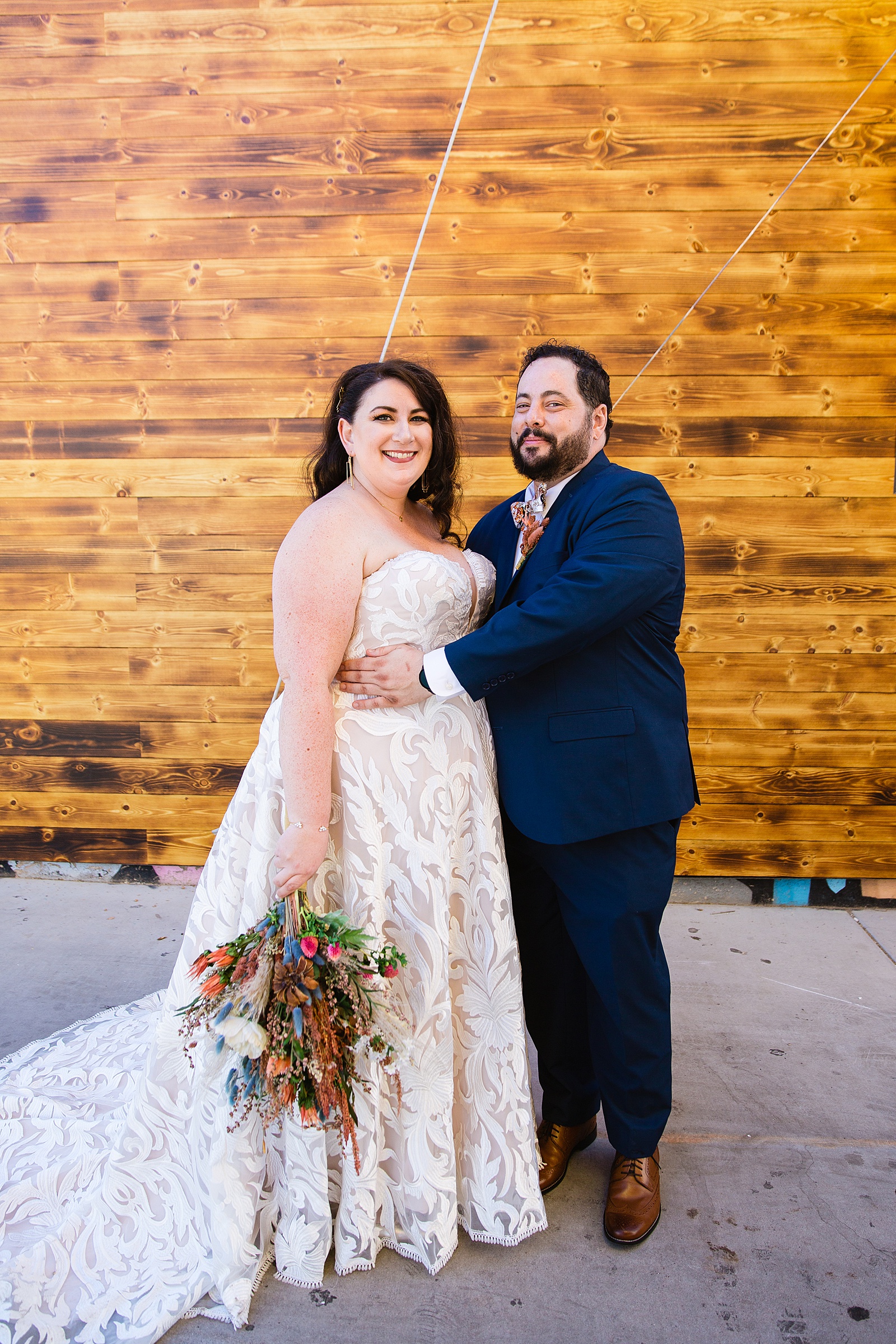 Bride and Groom pose during their MonOrchid wedding by Arizona wedding photographer PMA Photography.