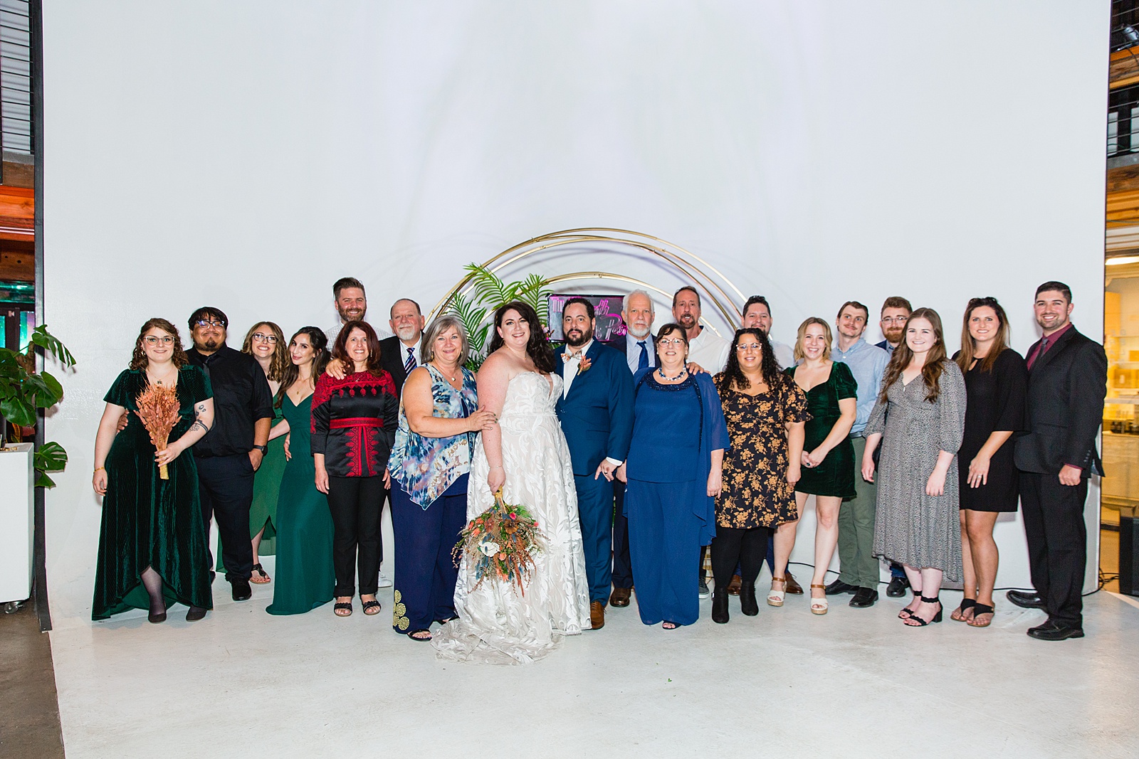 Bride and groom with their family at a MonOrchid wedding by Arizona wedding photographer PMA Photography.