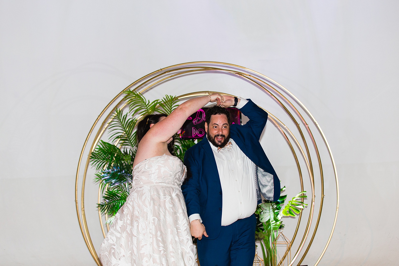 Bride and Groom sharing first dance at their MonOrchid wedding reception by Arizona wedding photographer PMA Photography.