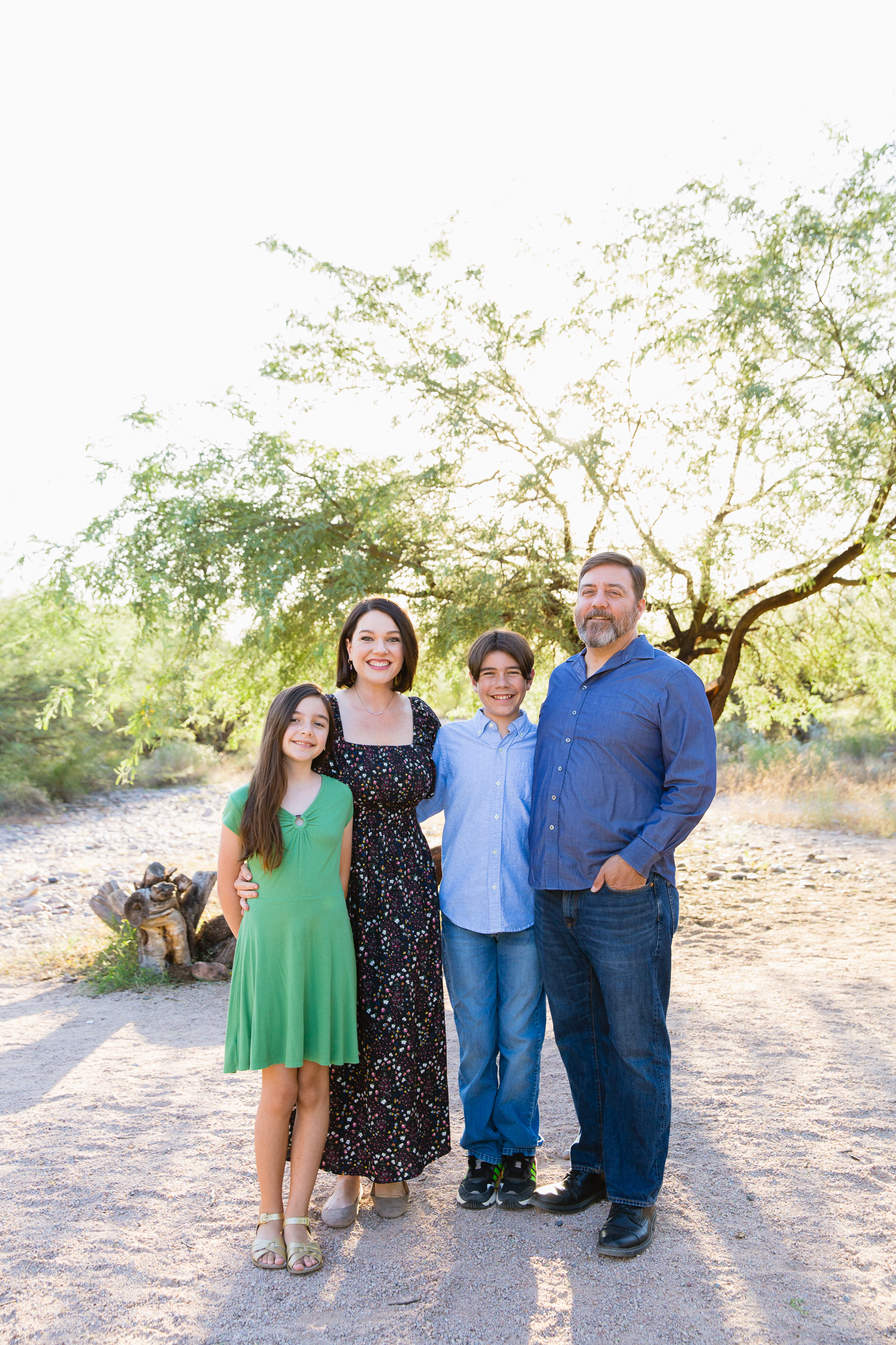 Family pose during their Phoenix family session by Arizona wedding photographer PMA Photography.