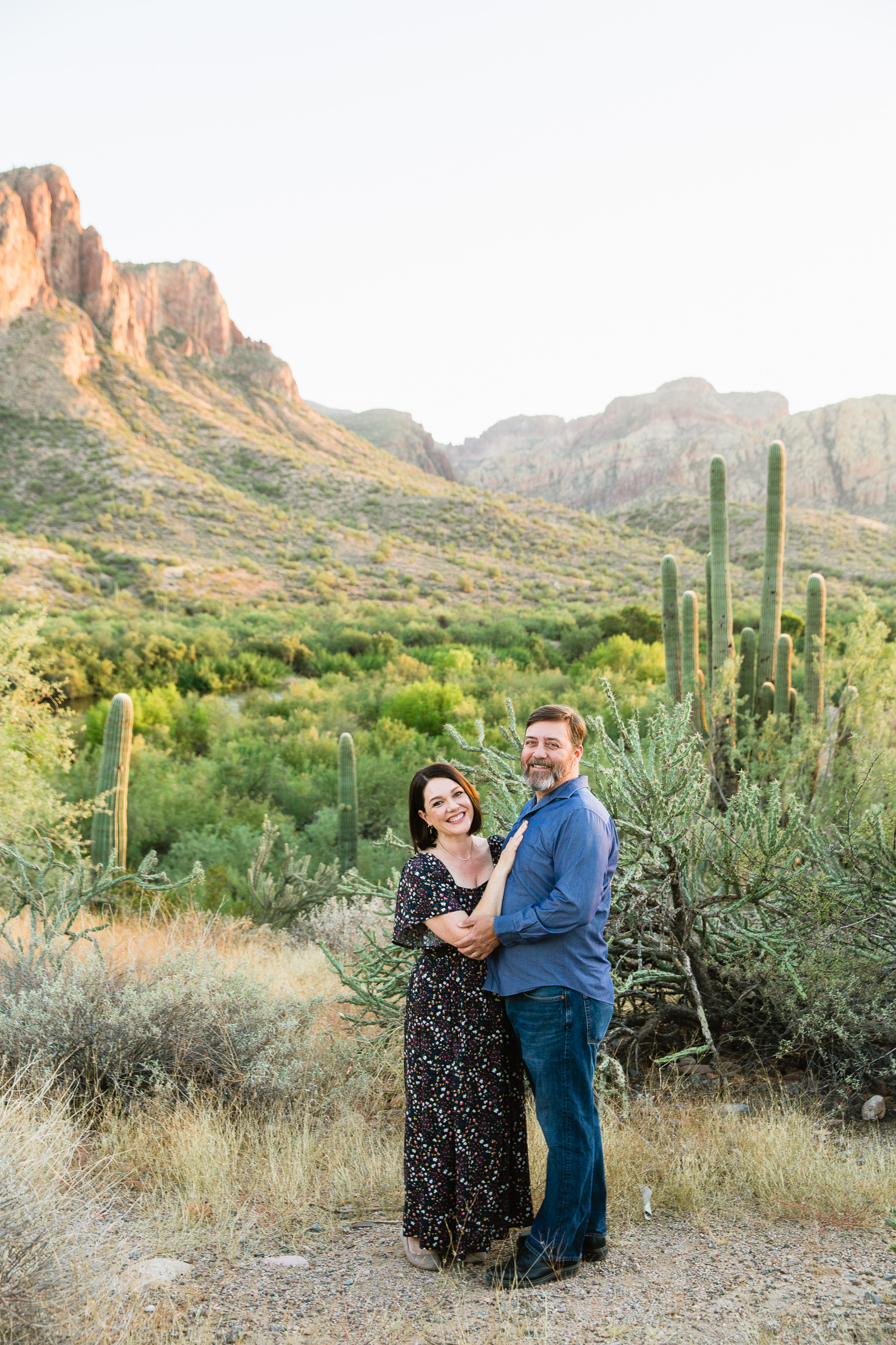 Parents pose together during their Phoenix family session by Arizona family photographer PMA Photography.