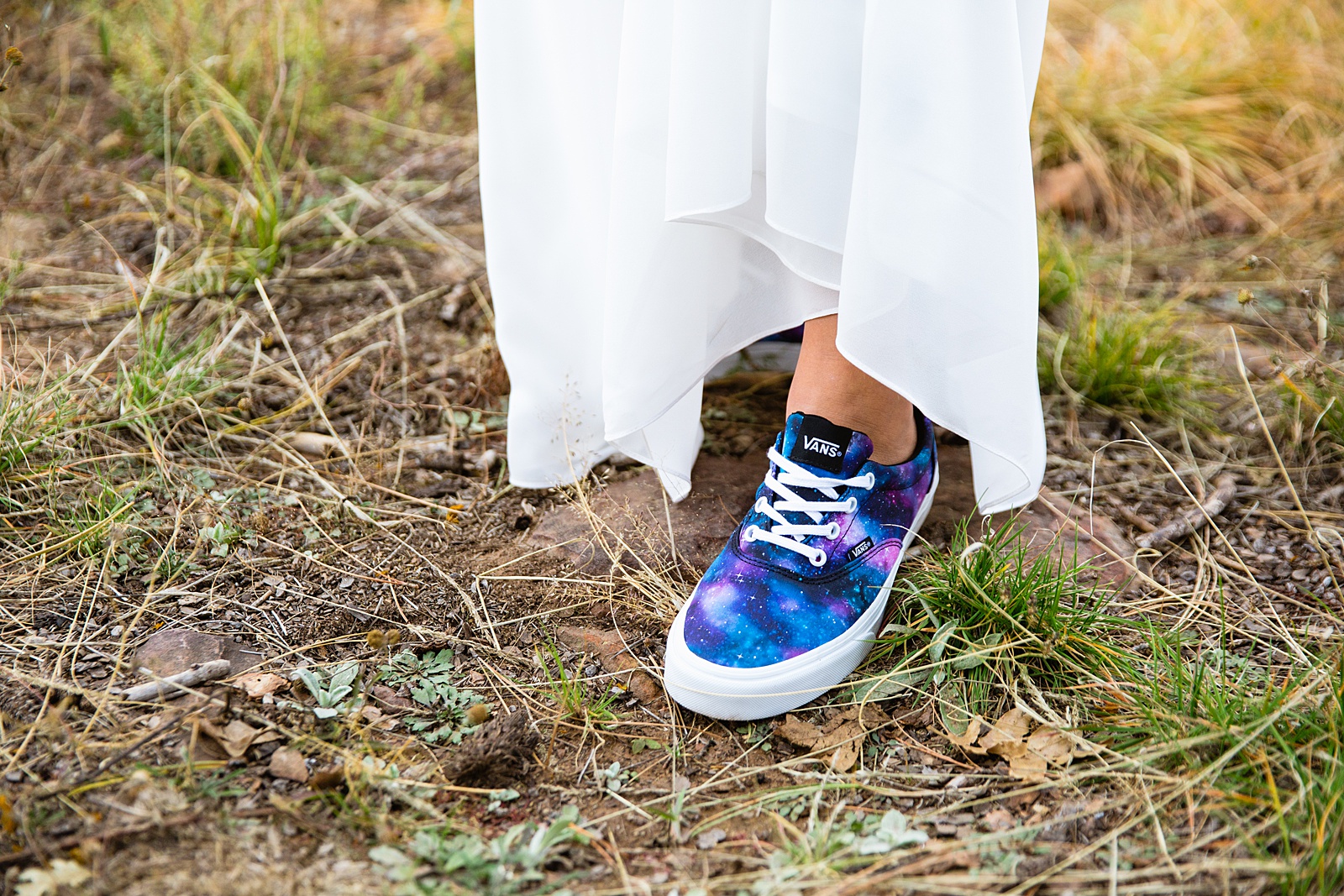 The bride wore blue and purple galaxy Vans for their Mogollon Rim elopement by Arizona wedding photographer PMA Photography.