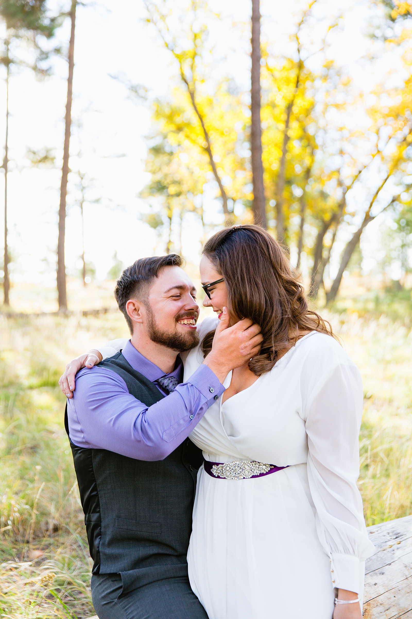 Bride and Groom laughing together during their Mogollon Rim elopement by Arizona elopement photographer PMA Photography.