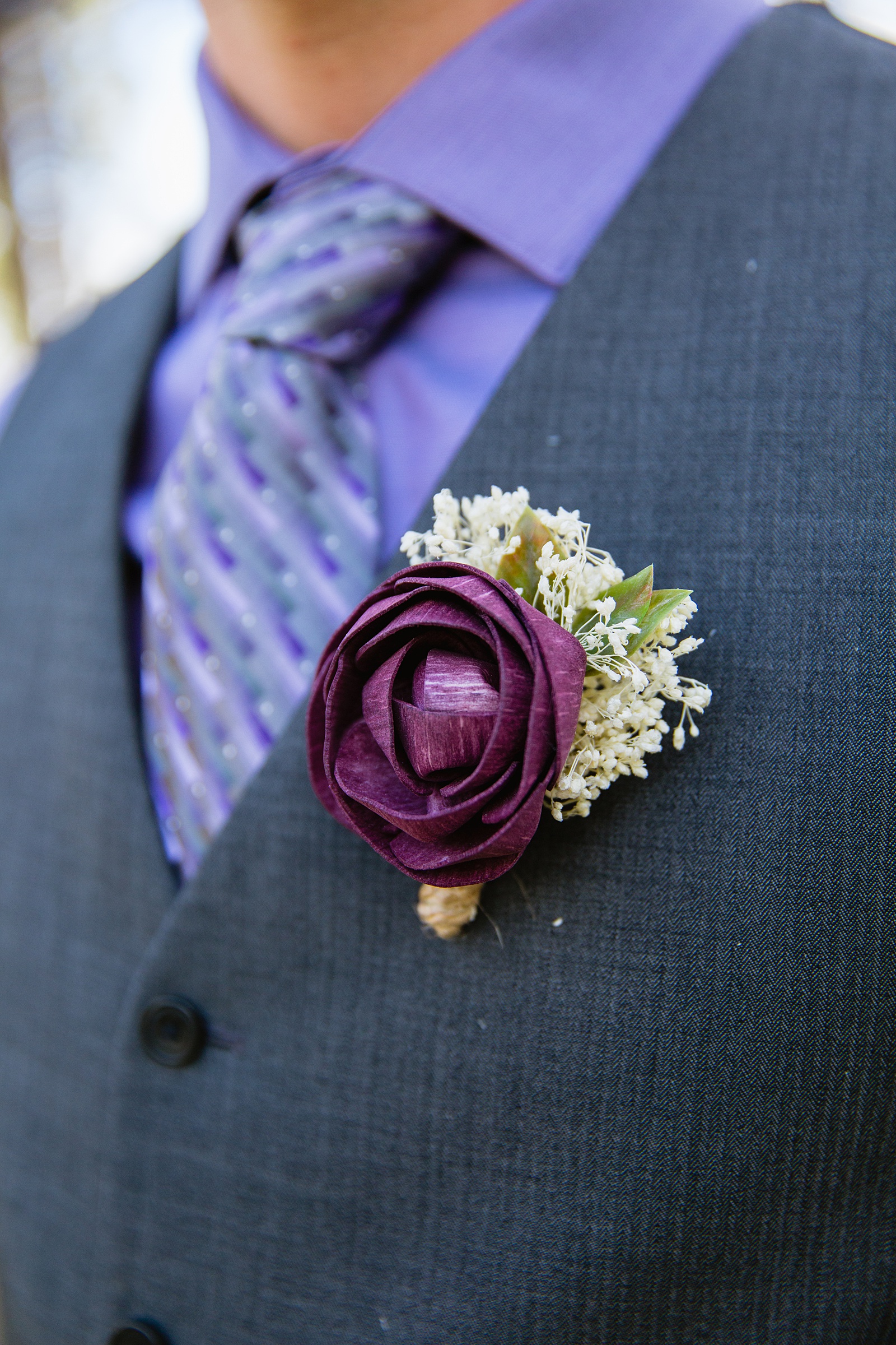 Groom's purple wooden flower boutonniere by PMA Photography.
