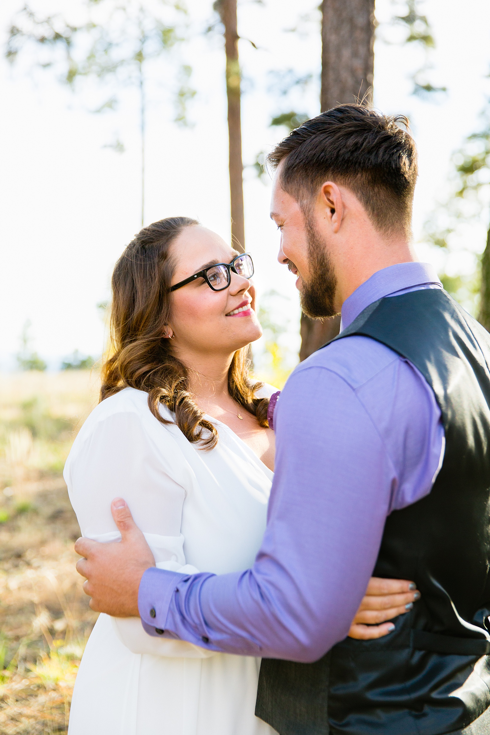 Bride and Groom smiling at each other during their Mogollon Rim elopement by Arizona elopement photographer PMA Photography.