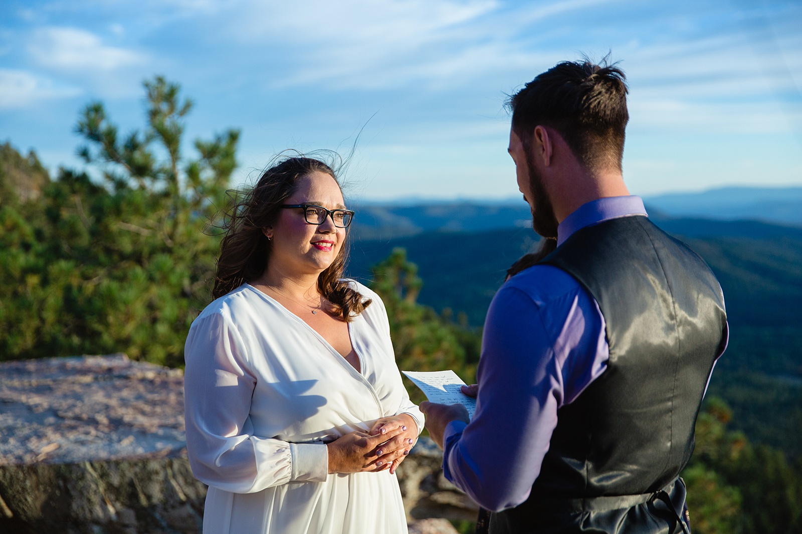 Groom reading his vows during their wedding ceremony at Mogollon Rim by Payson elopement photographer PMA Photography.