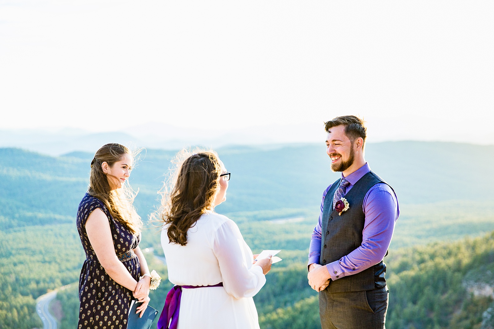 Bride reading her vows during their wedding ceremony at Mogollon Rim by Payson elopement photographer PMA Photography.