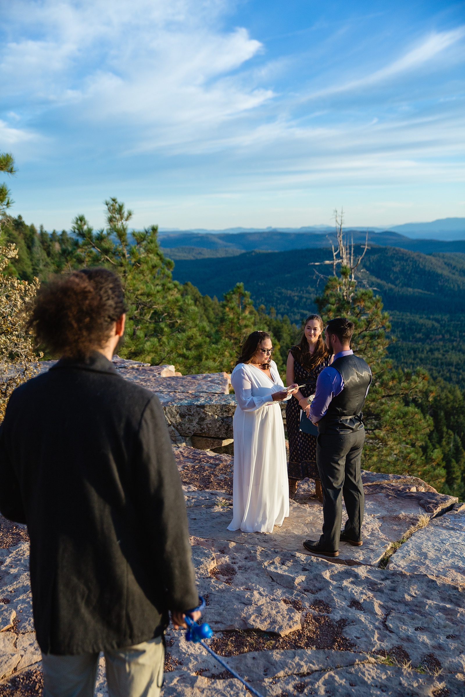 Bride reading her vows during their wedding ceremony at Mogollon Rim by Payson elopement photographer PMA Photography.