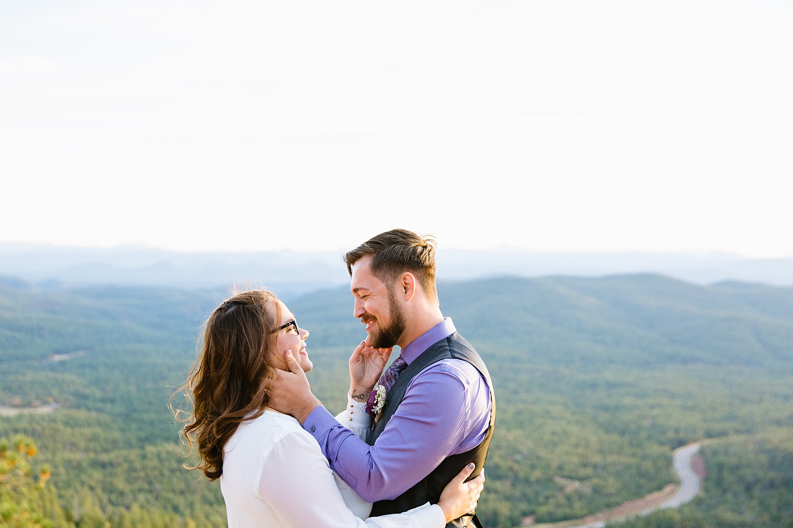Bride and Groom share and intimate moment after their first kiss during their wedding ceremony at Mogollon Rim by Arizona elopement photographer PMA Photography.