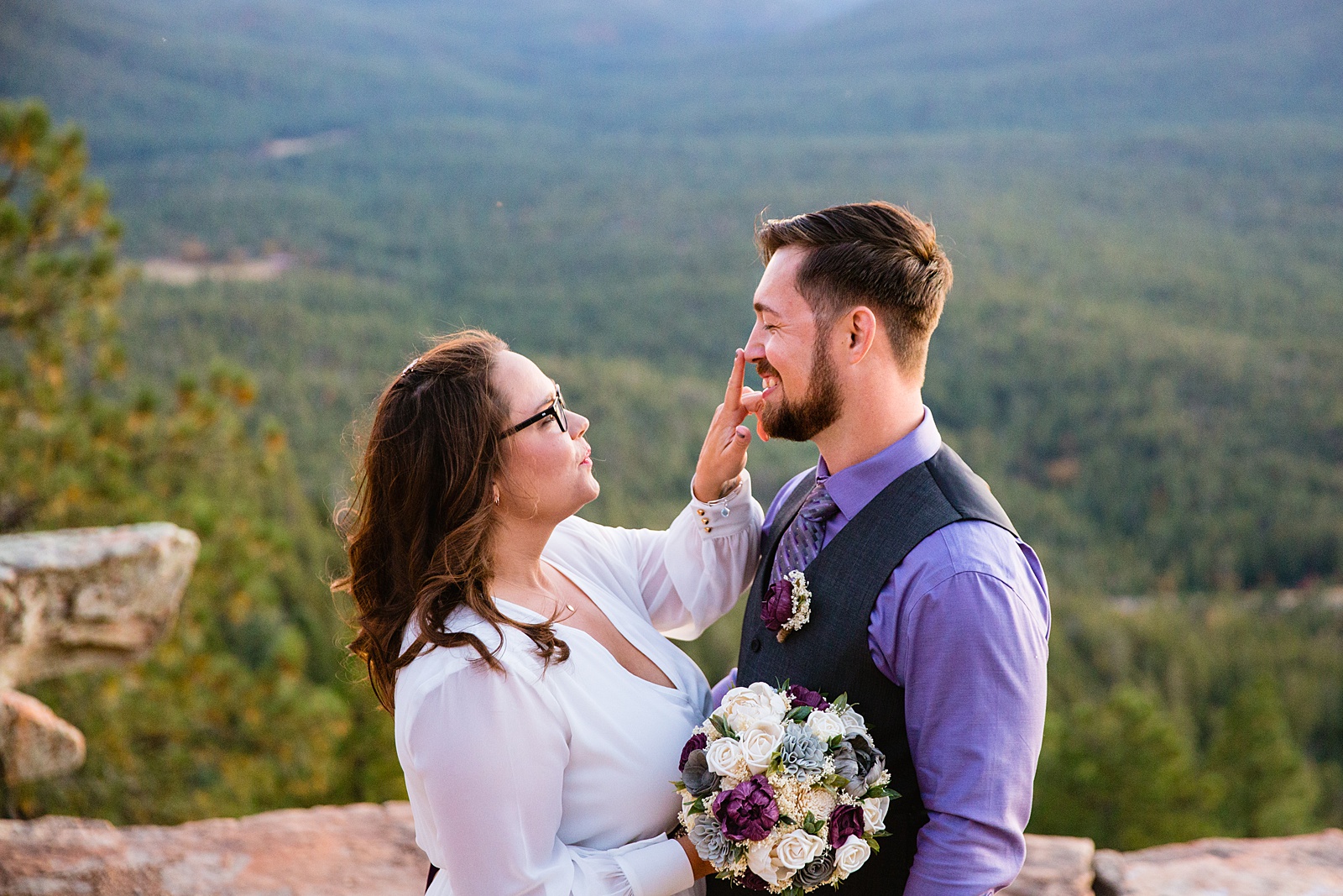 Bride and Groom laughing together during their Mogollon Rim elopement by Arizona elopement photographer PMA Photography.
