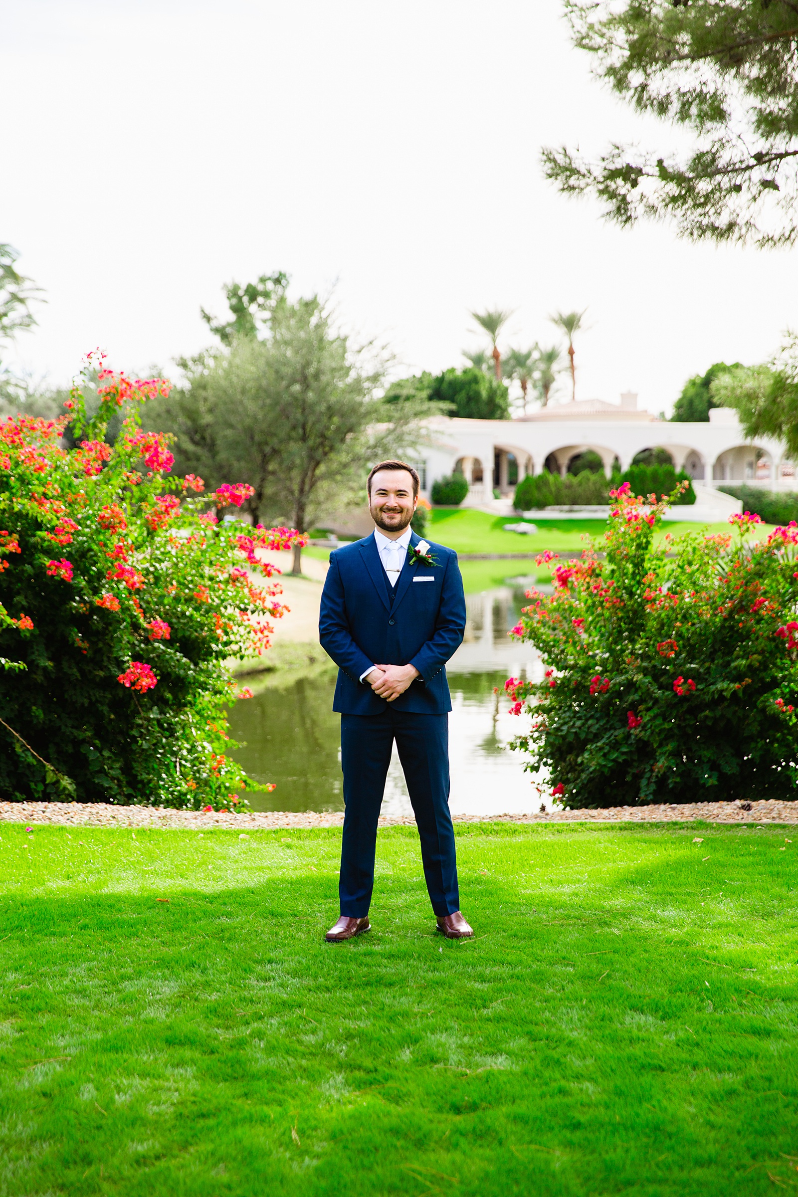 Groom's navy suit for his Ocotillo Oasis wedding by PMA Photography.