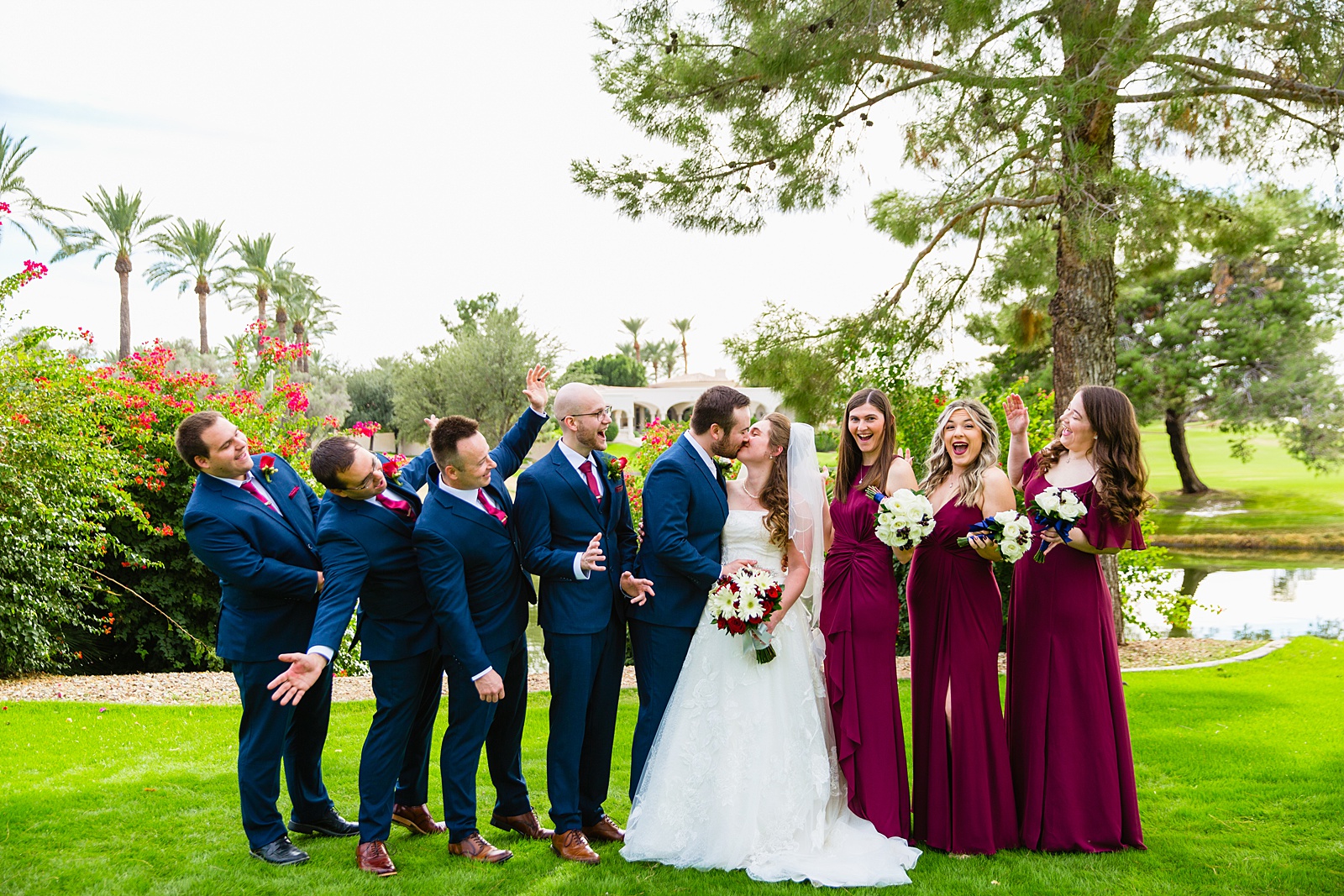 Bridal party having fun together at Ocotillo Oasis weding by Arizona wedding photographer PMA Photography.