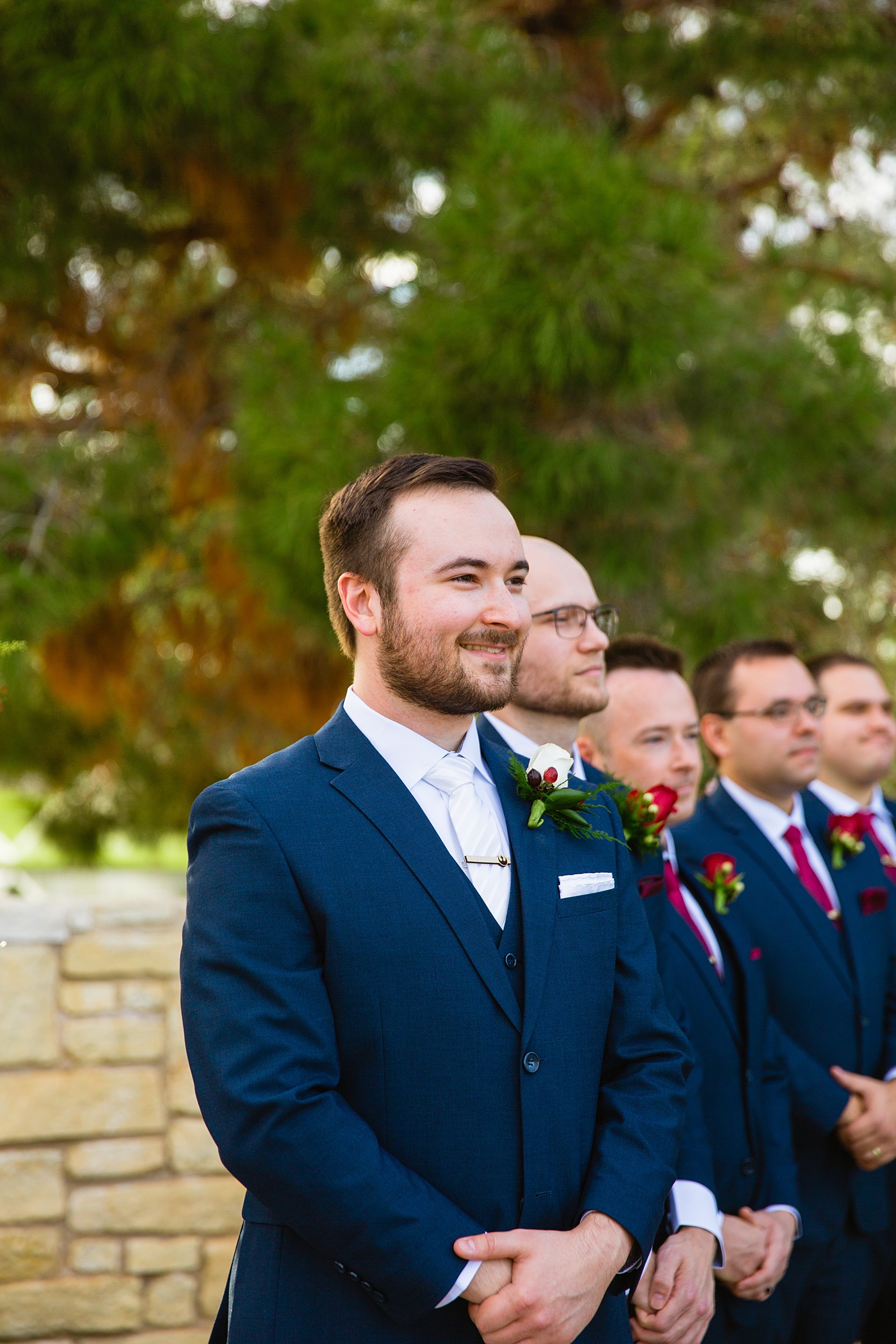Groom as the bride walks down the aisle by PMA Photography.