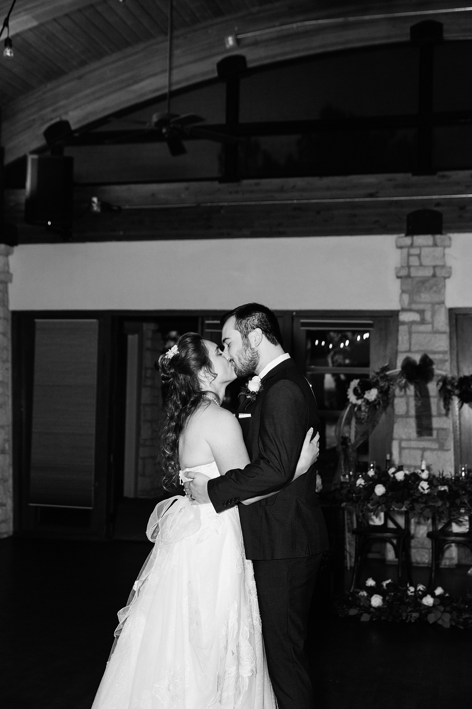 Bride and Groom sharing first dance at their Ocotillo Oasis wedding reception by Arizona wedding photographer PMA Photography.
