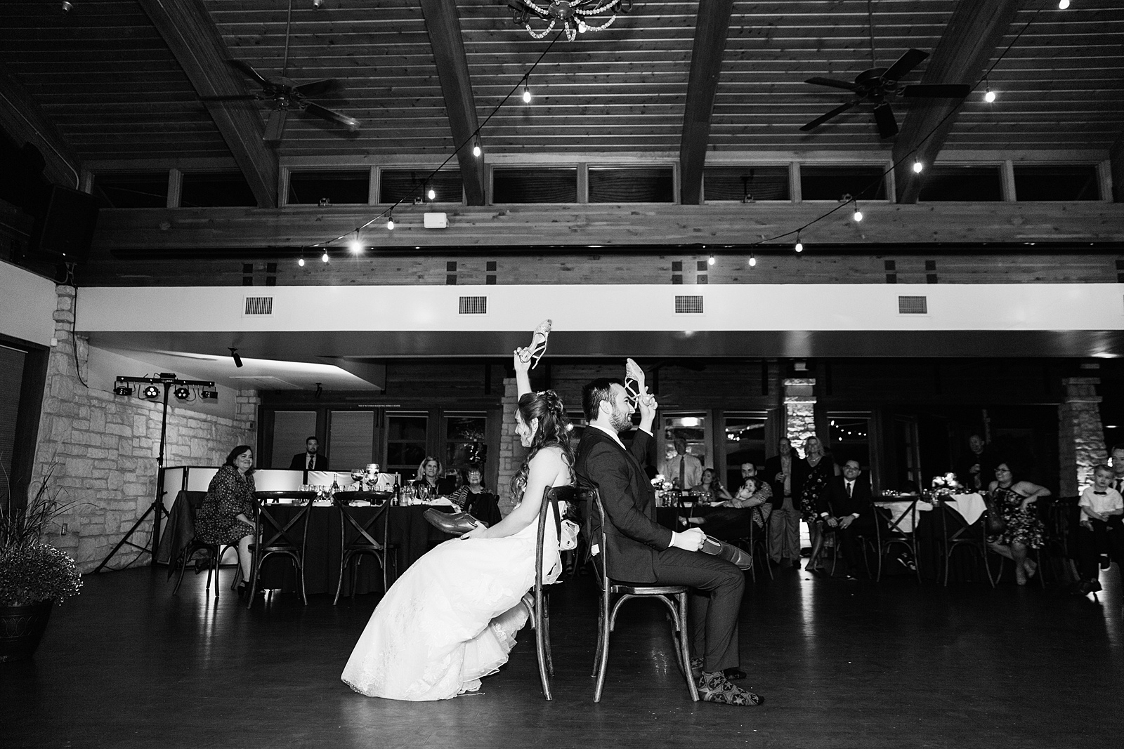 Bride and Groom play newlywed game durring wedding reception at Ocotillo Oasis by Arizona wedding photographer PMA Photography.