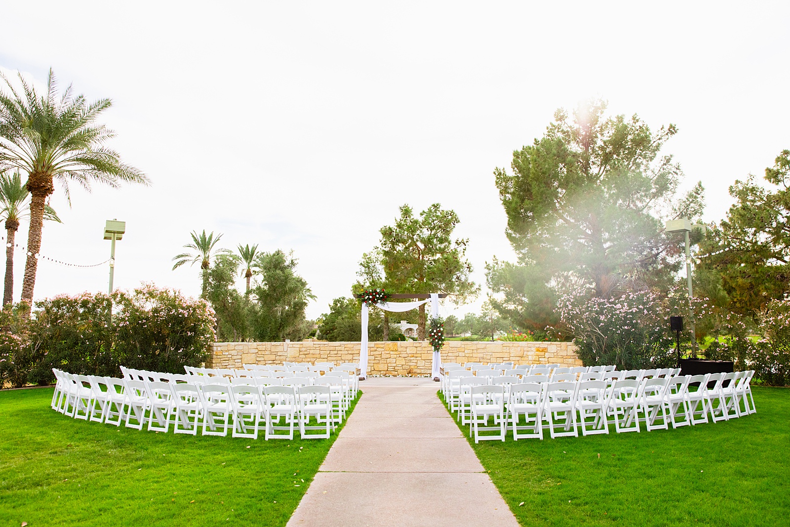 Outdoor wedding ceremony at Ocotillo Oasis by Phoenix wedding photographer PMA Photography.