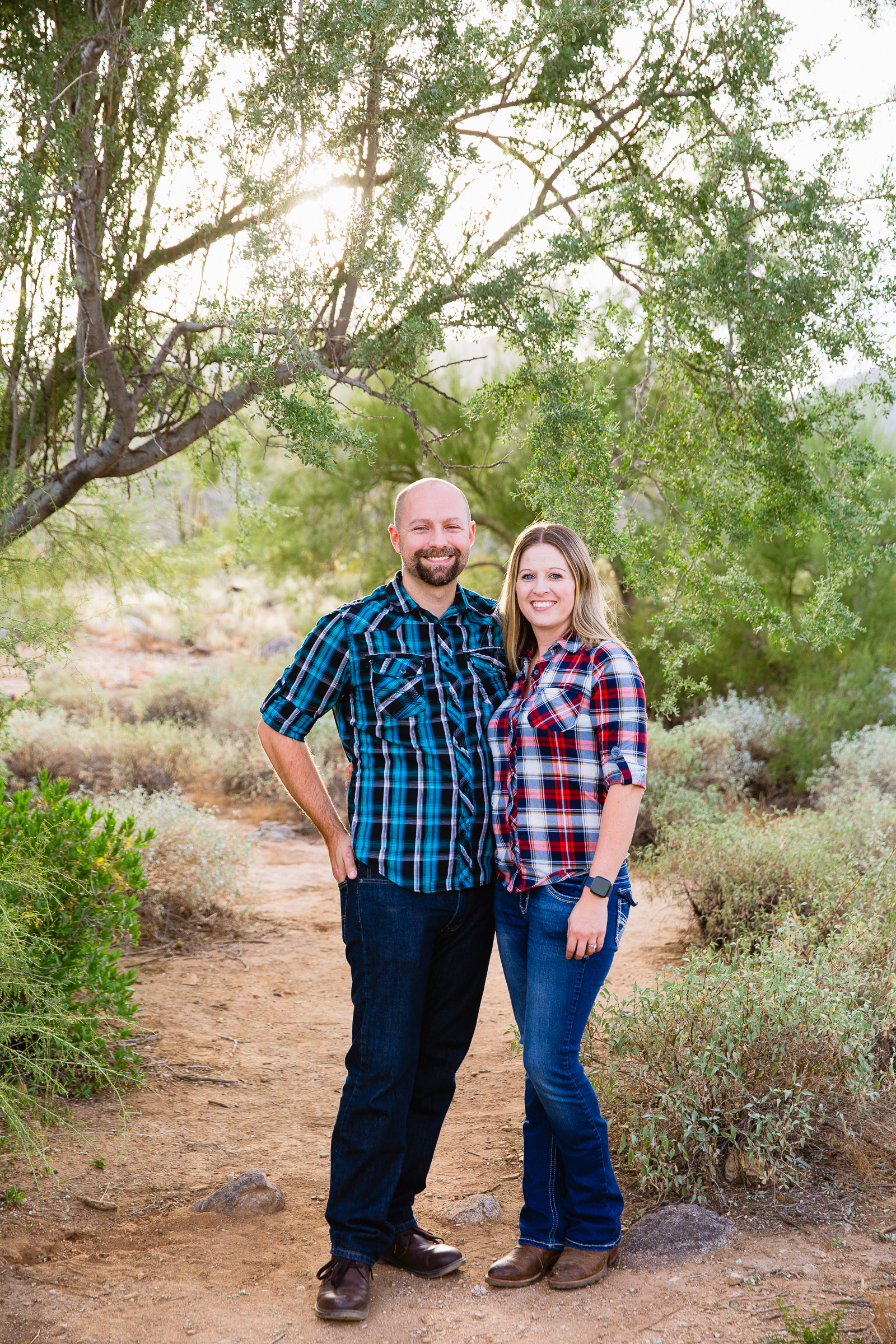 Parents pose together during their White Tanks family session by Waddell family photographer PMA Photography.