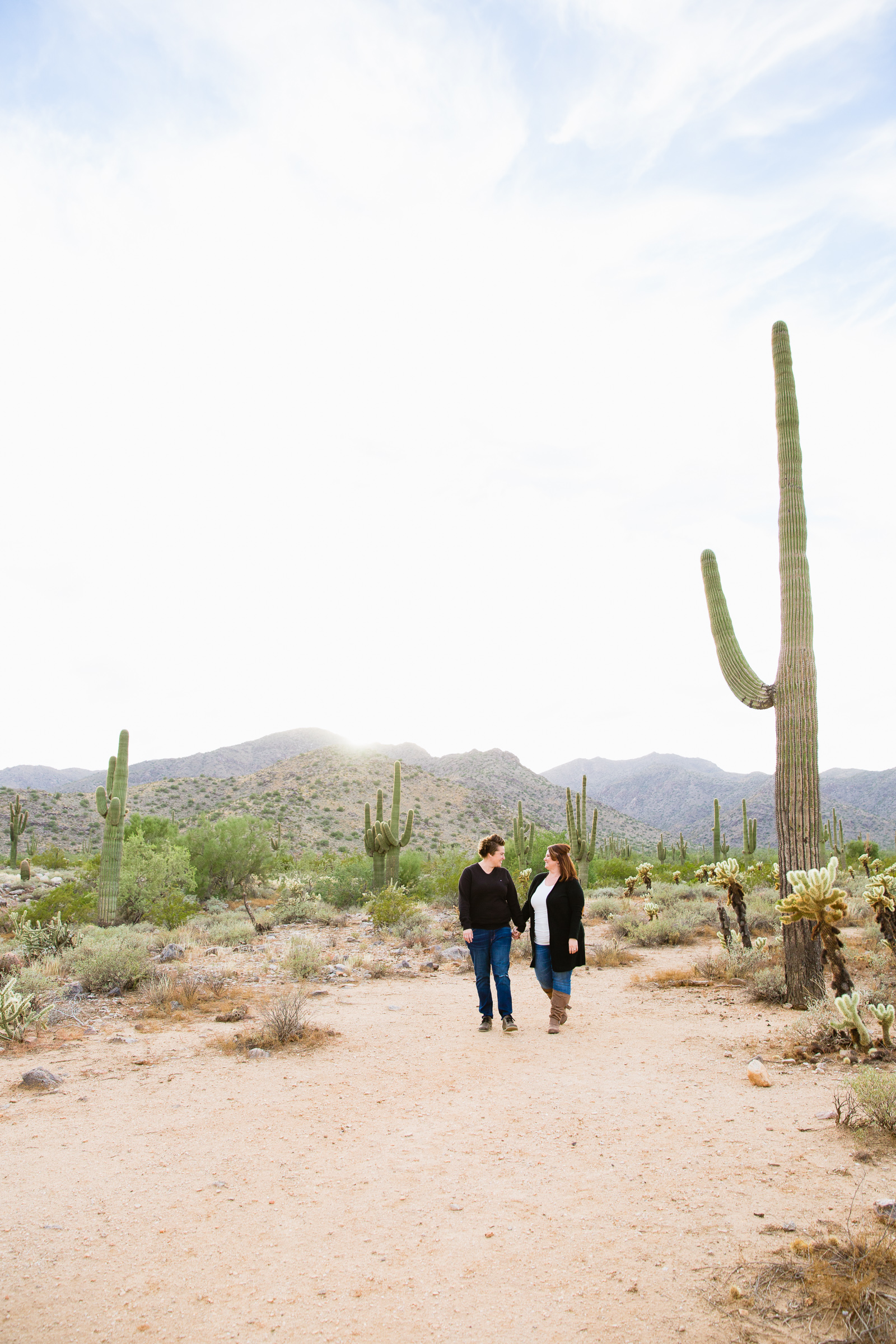 Couple walking together during their Waddell anniversary session by Arizona engagement photographer PMA Photography.
