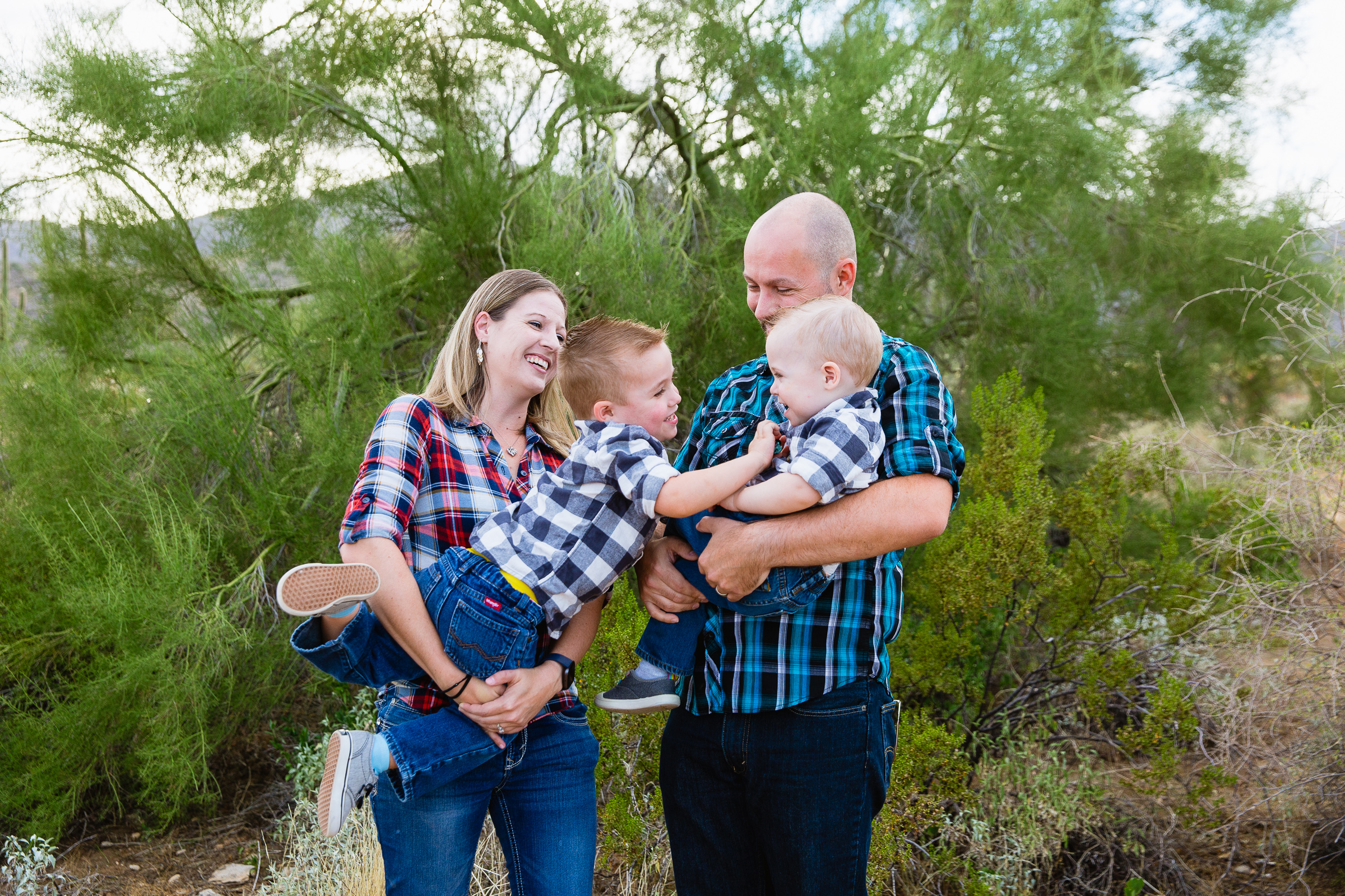 Family having fun together at their White Tanks family session by Waddell family photographer PMA Photography.